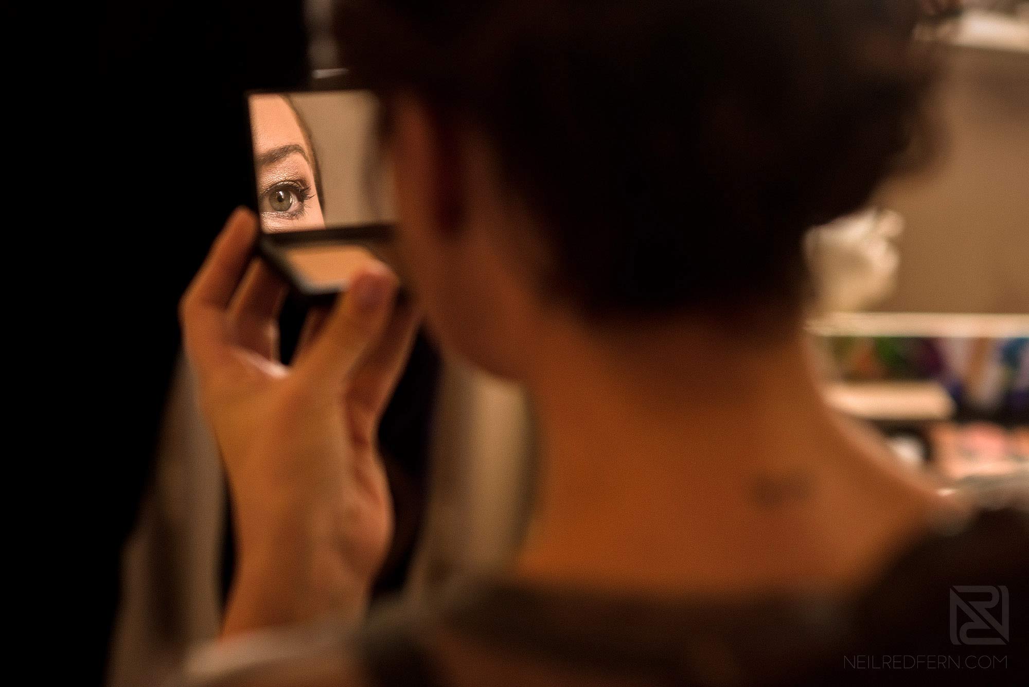 Summer wedding at Arley Hall 3 bridesmaid looking in to mirror