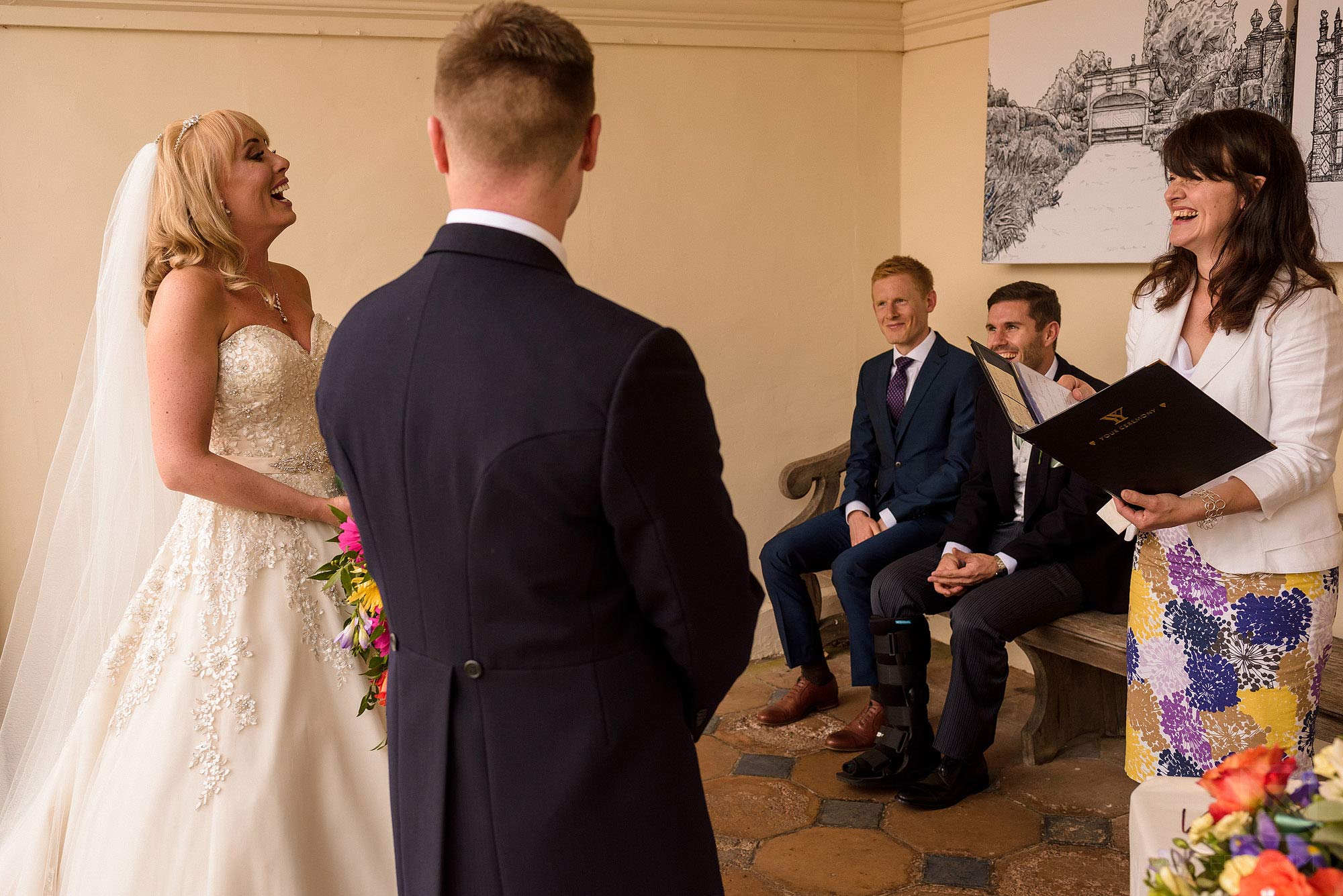 Summer wedding at Arley Hall 13 bride and groom laughing during wedding ceremony at Arley Hall