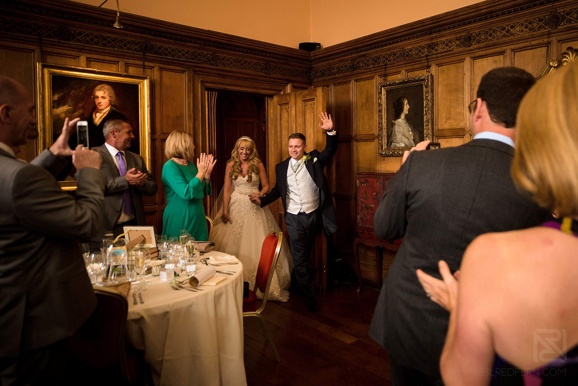 Summer wedding at Arley Hall 31 bride and groom make entrance in to wedding breakfast at Arley Hall