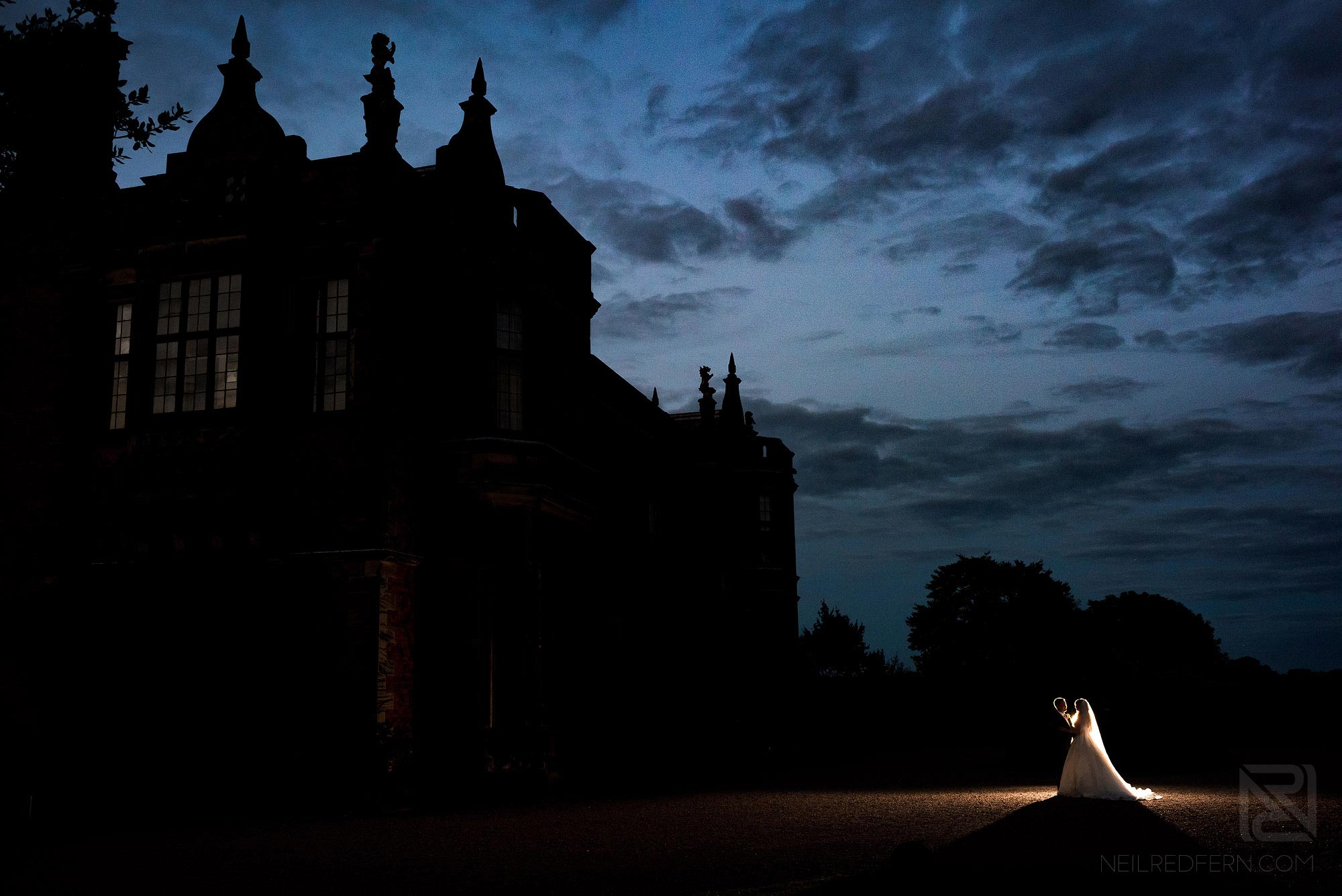 Arley Hall wedding photography 26 creative night time photograph of bride and groom outside Arley Hall