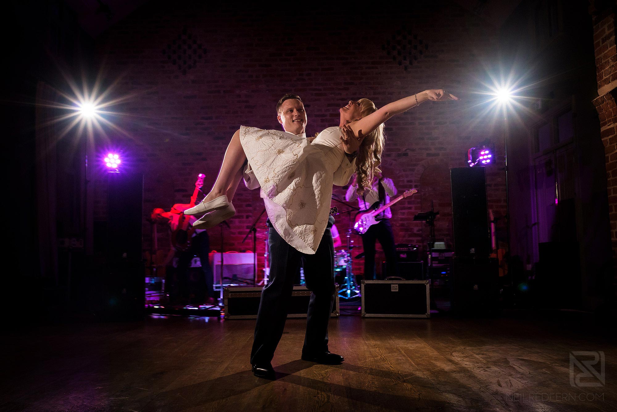 Summer wedding at Arley Hall 42 groom picking up bride during first dance