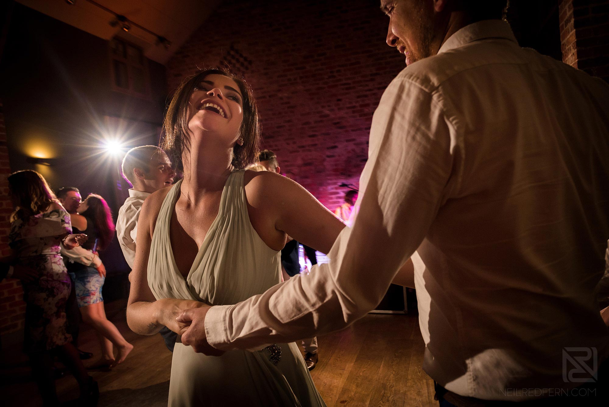 bridesmaid dancing during evening wedding reception