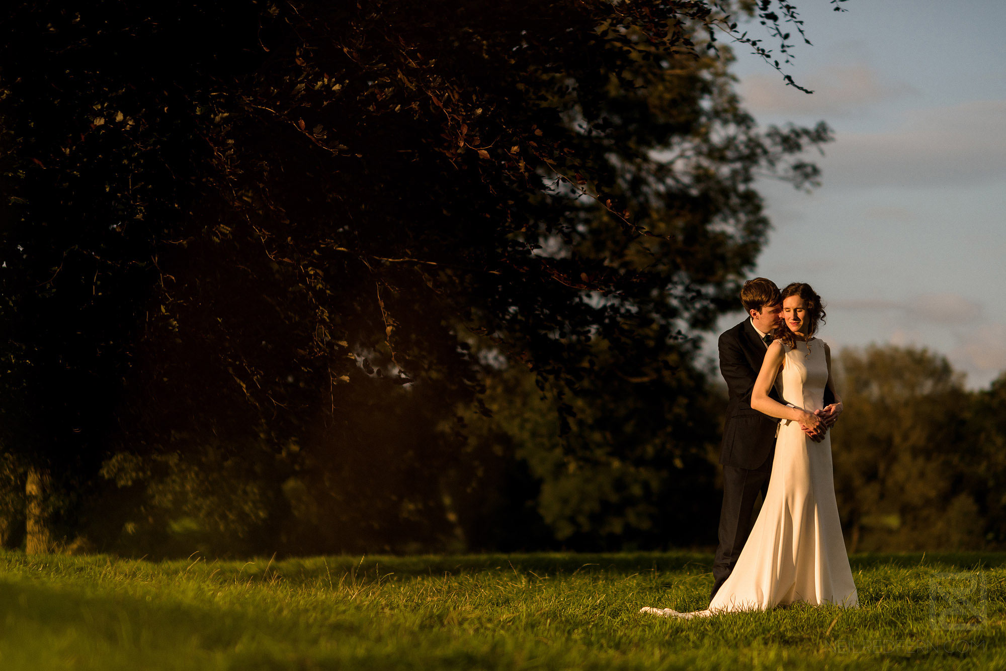 stunning portrait of bride and groom at sunset