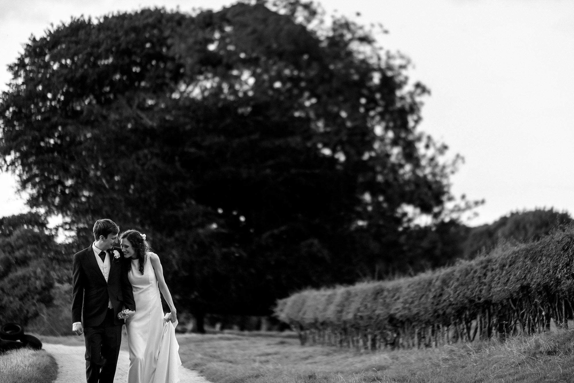 natural moment between bride and groom at Adlington Hall