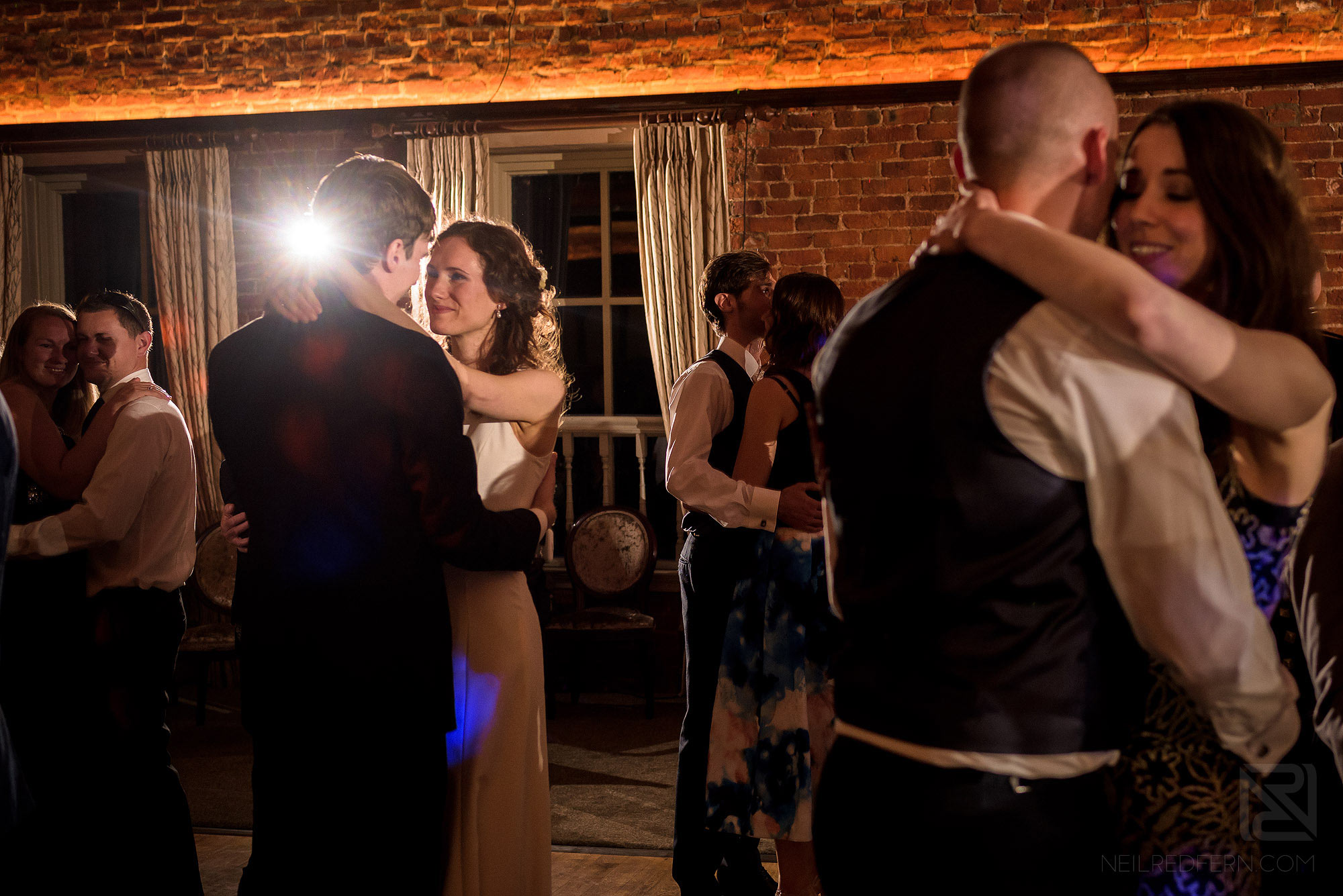 newlyweds and guests dancing at Adlington Hall wedding reception