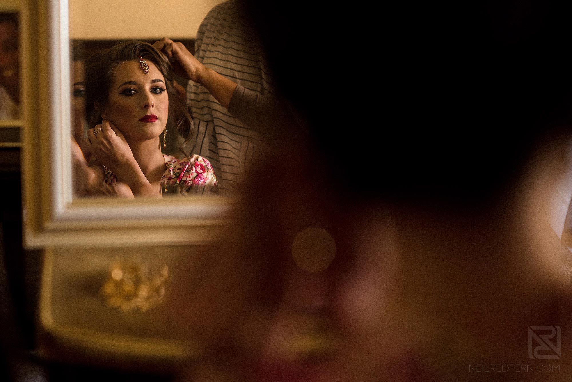 Indian bride looking in to mirror