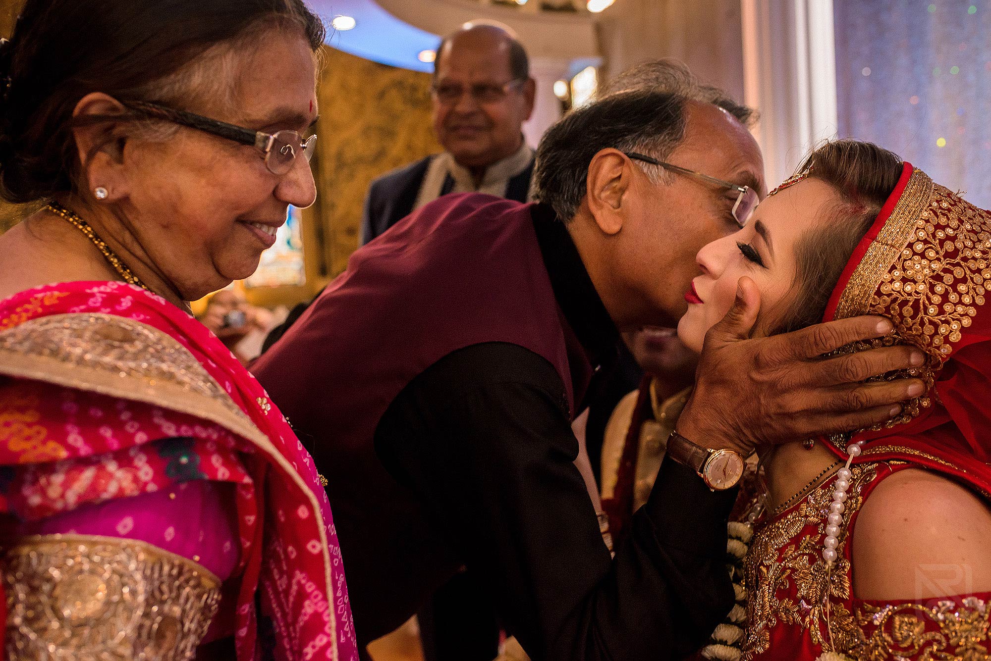 Indian bride being congratulated by friends