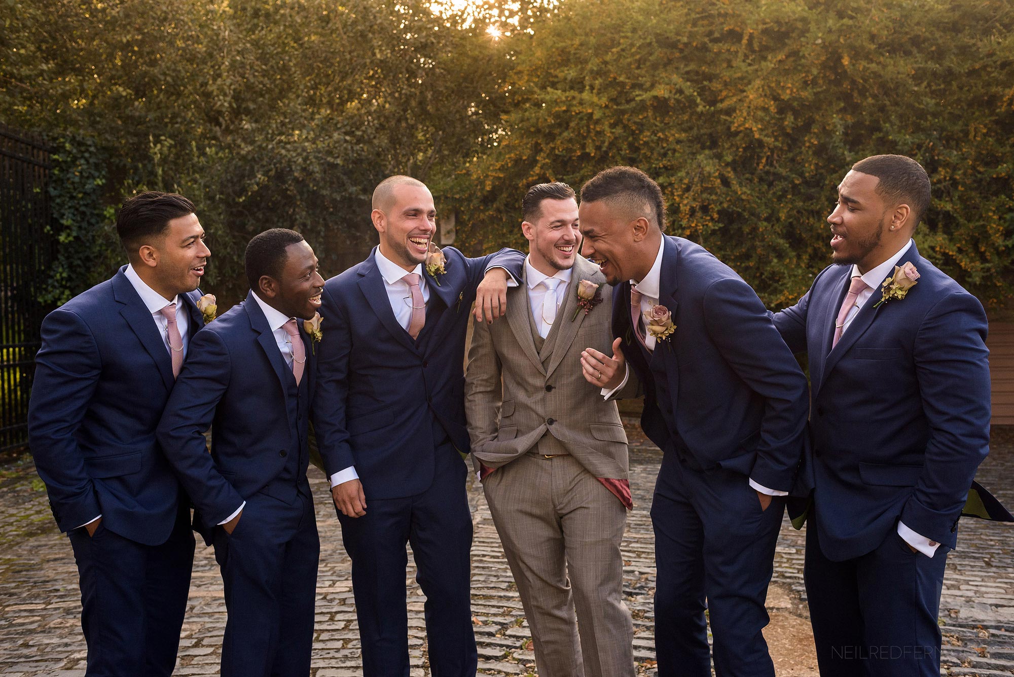 groom and ushers outside Shakespere's Globe at wedding