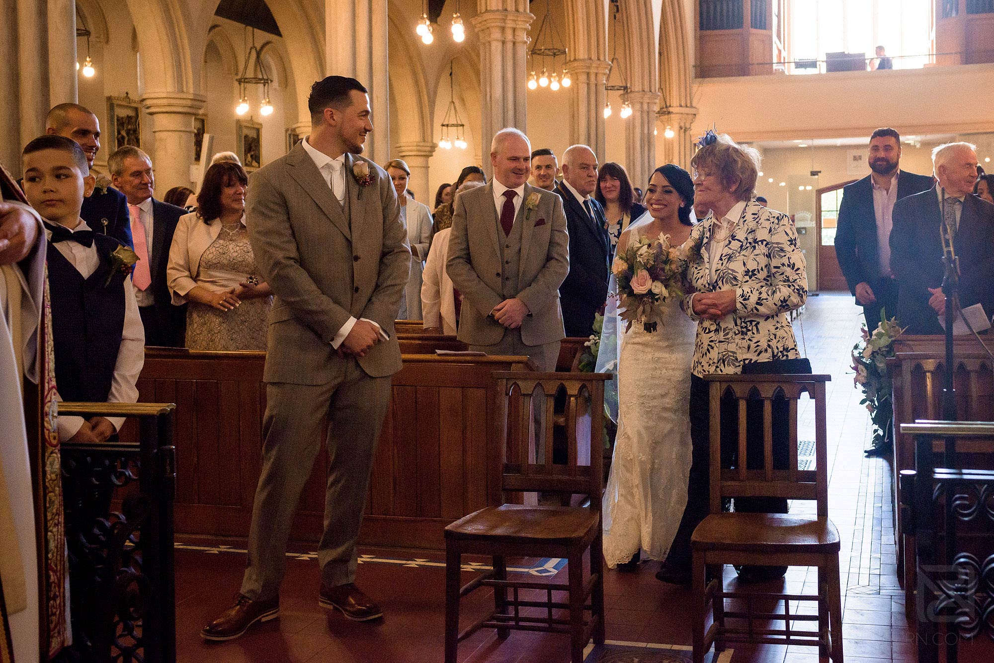 bride walking down the aisle in St Mary of the Angels church
