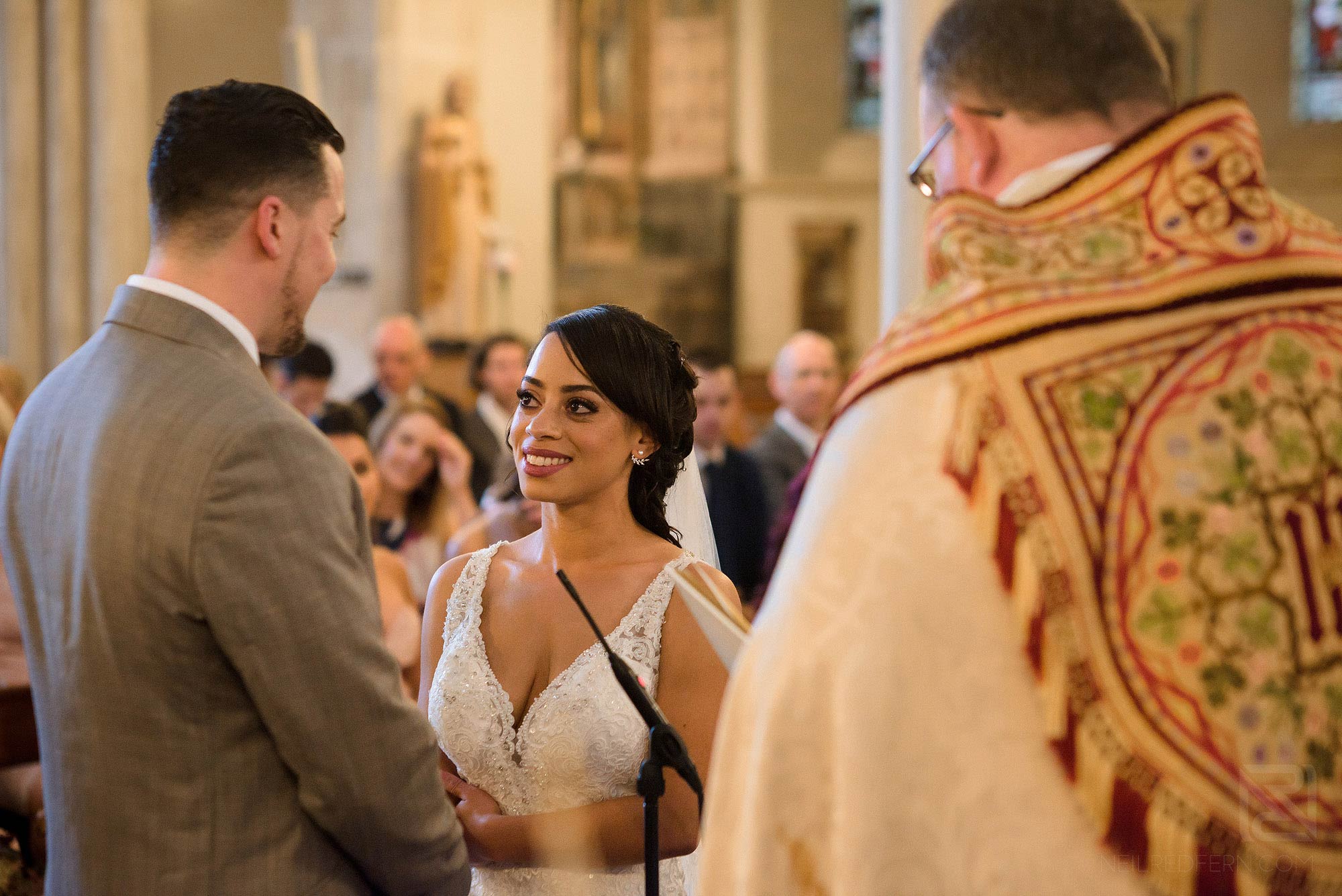 bride and groom looking at each other during wedding ceremony