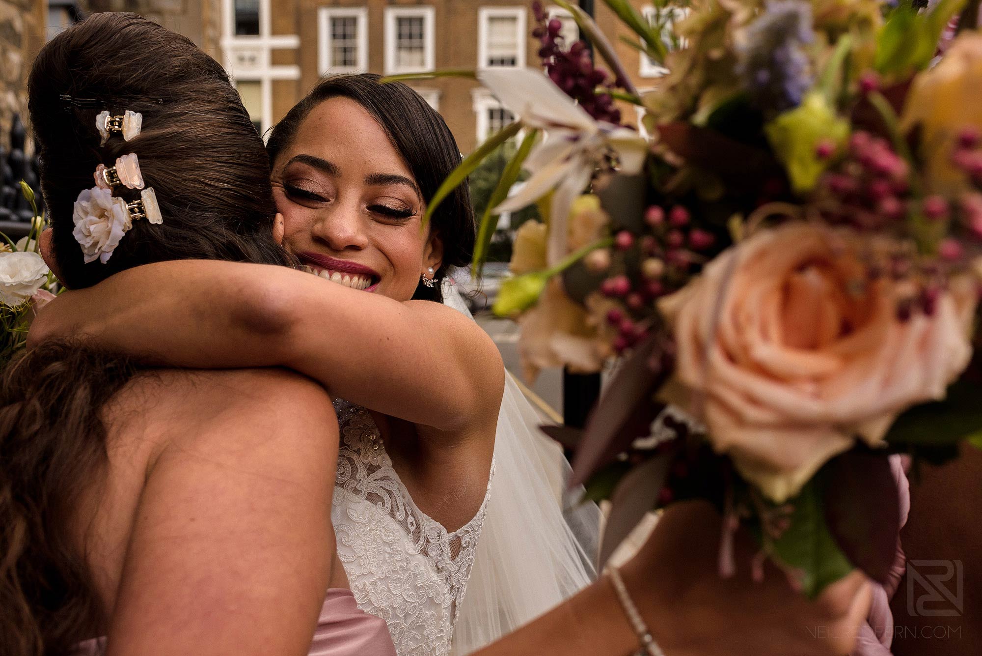 bridesmaid congratulating bride outside church
