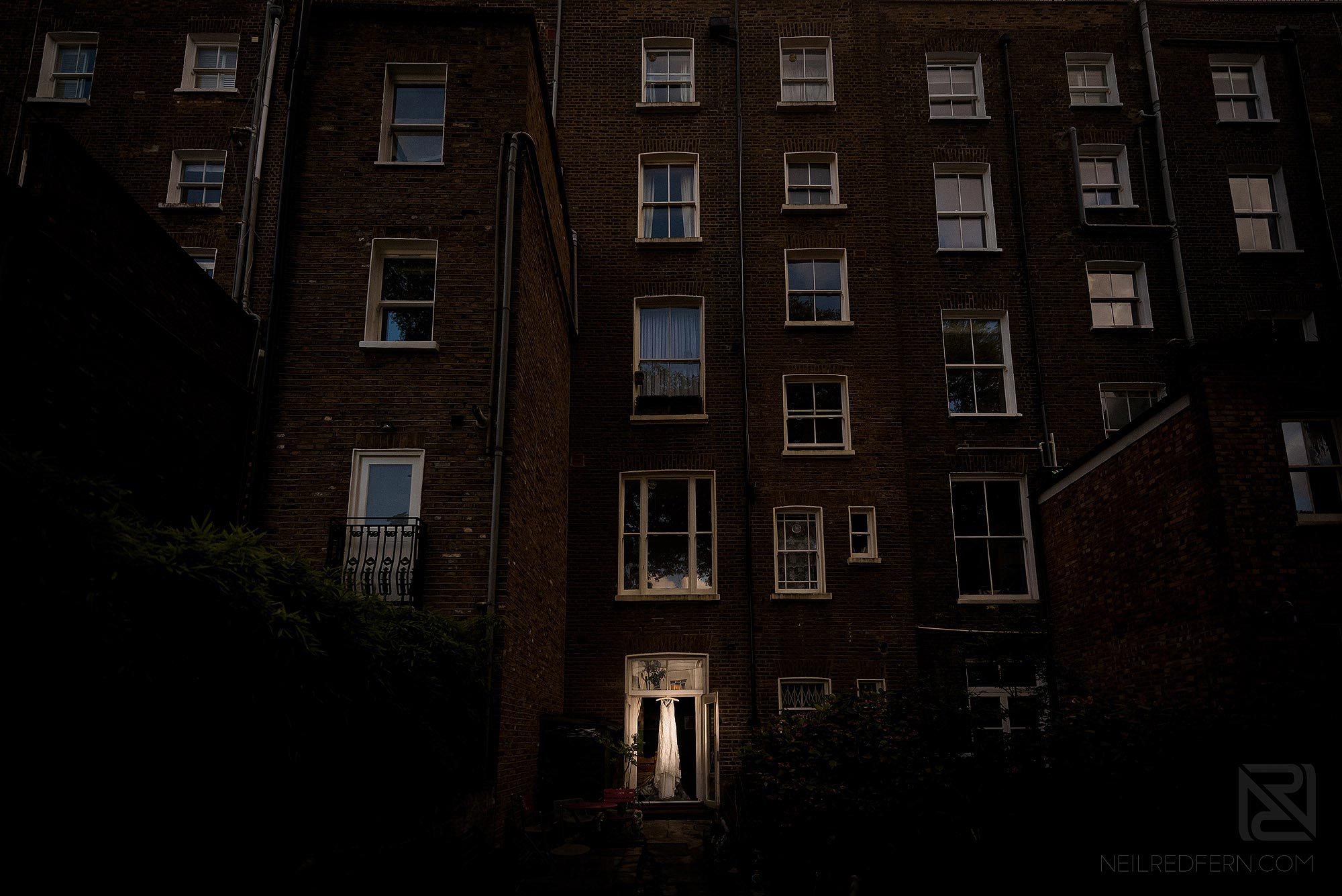 photograph of bride's wedding dress hug up
