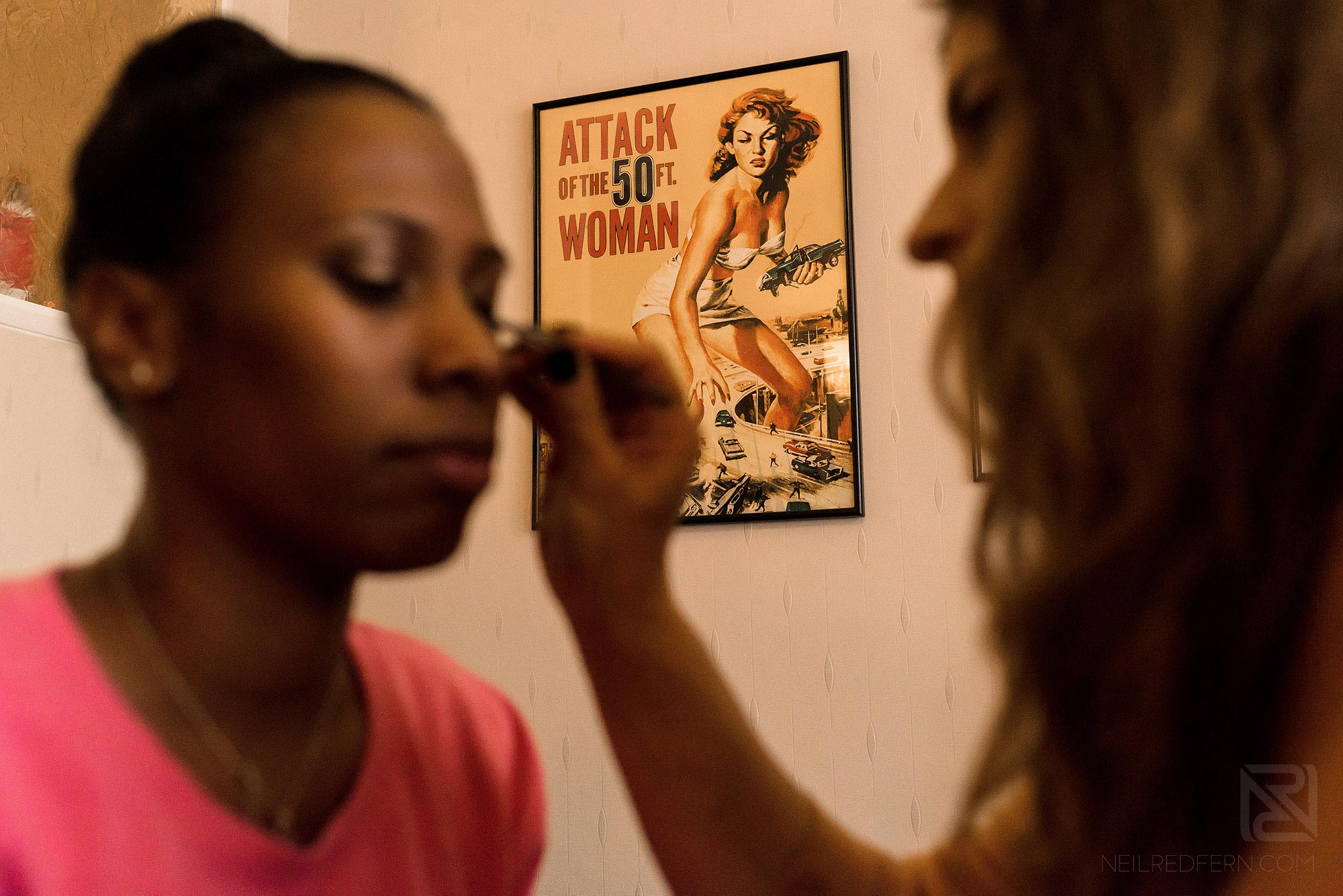 bridesmaid having make-up put on