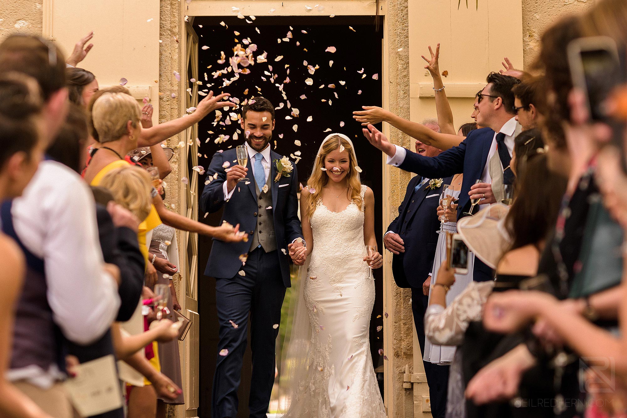 wedding guests throwing confetti