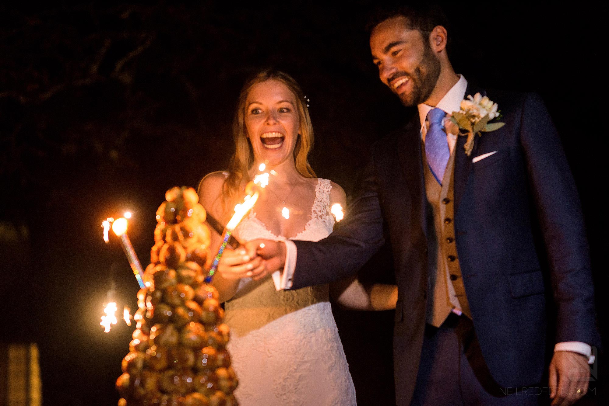 bride and groom cutting cake