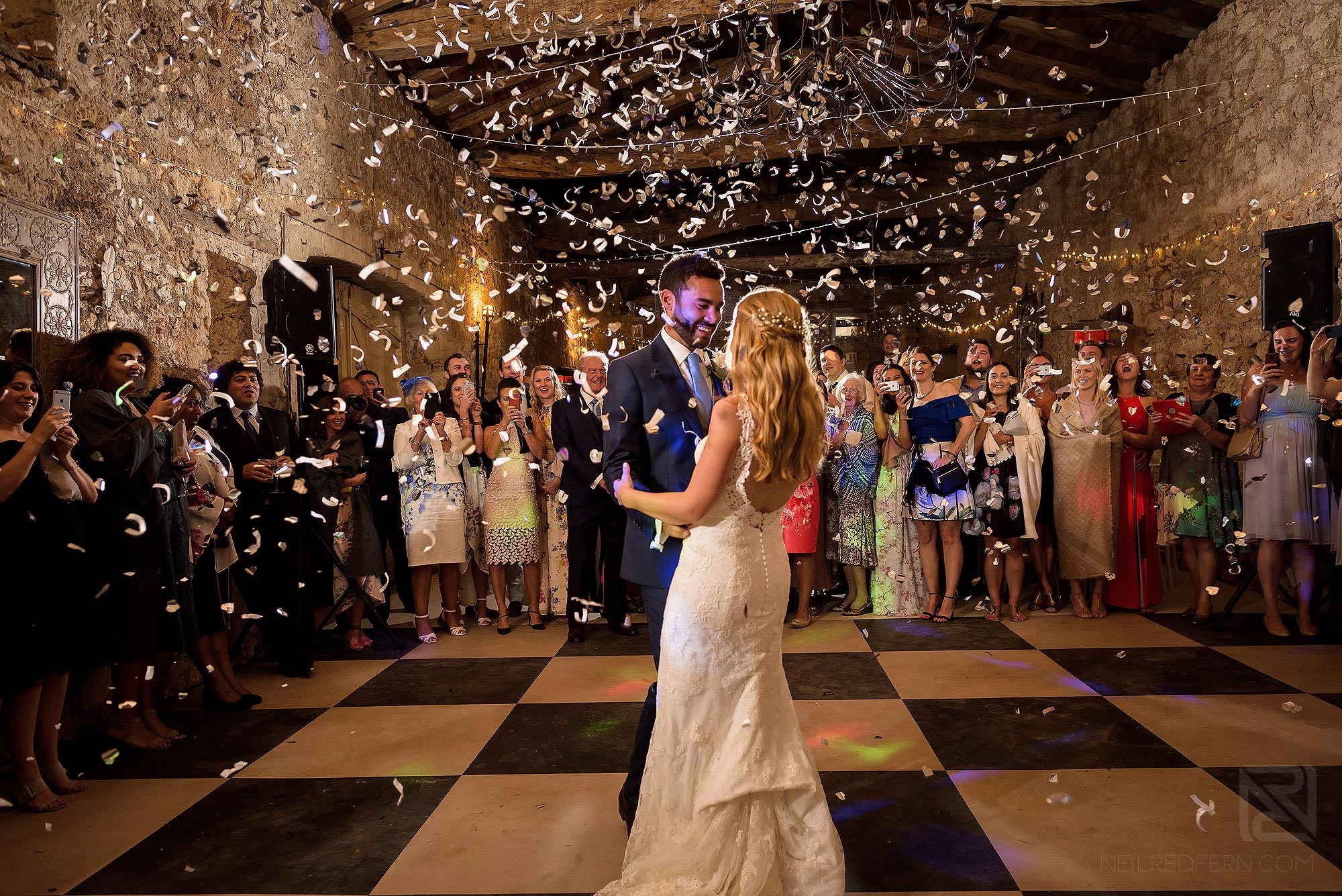 bride and groom first dance with confetti cannons