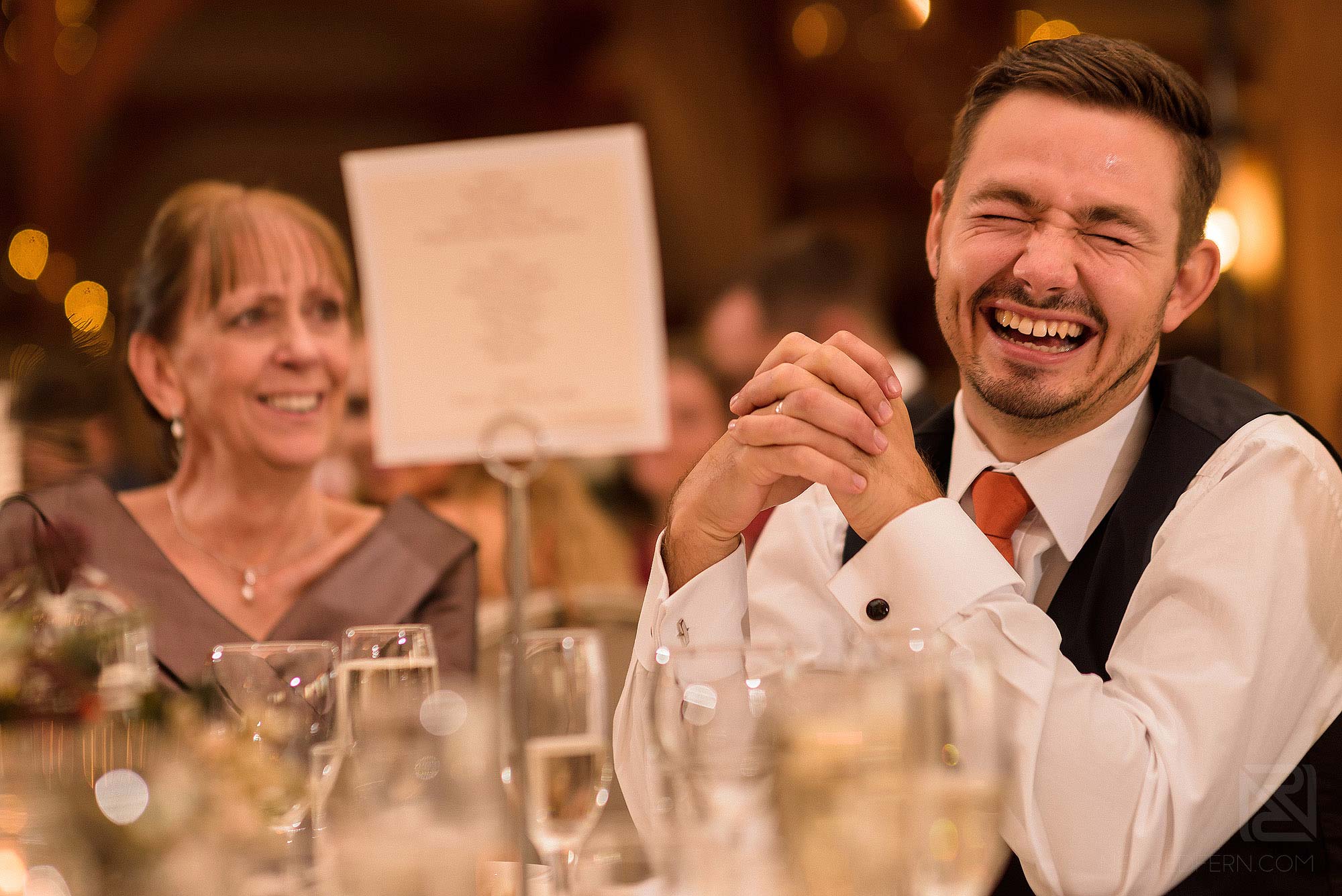 best man laughing during wedding speeches