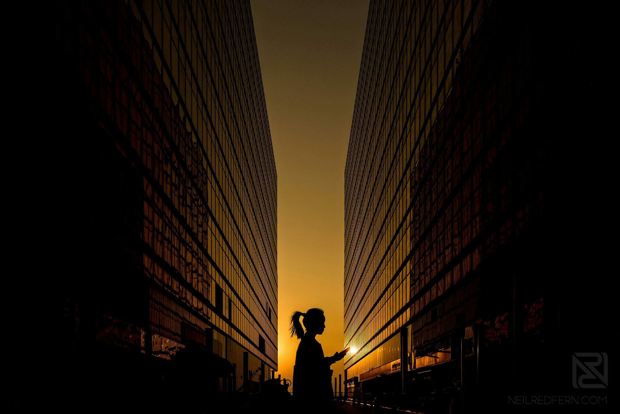 Hong Kong Travel Photography 1 silhouette of woman walking past China Hong Kong City buildings