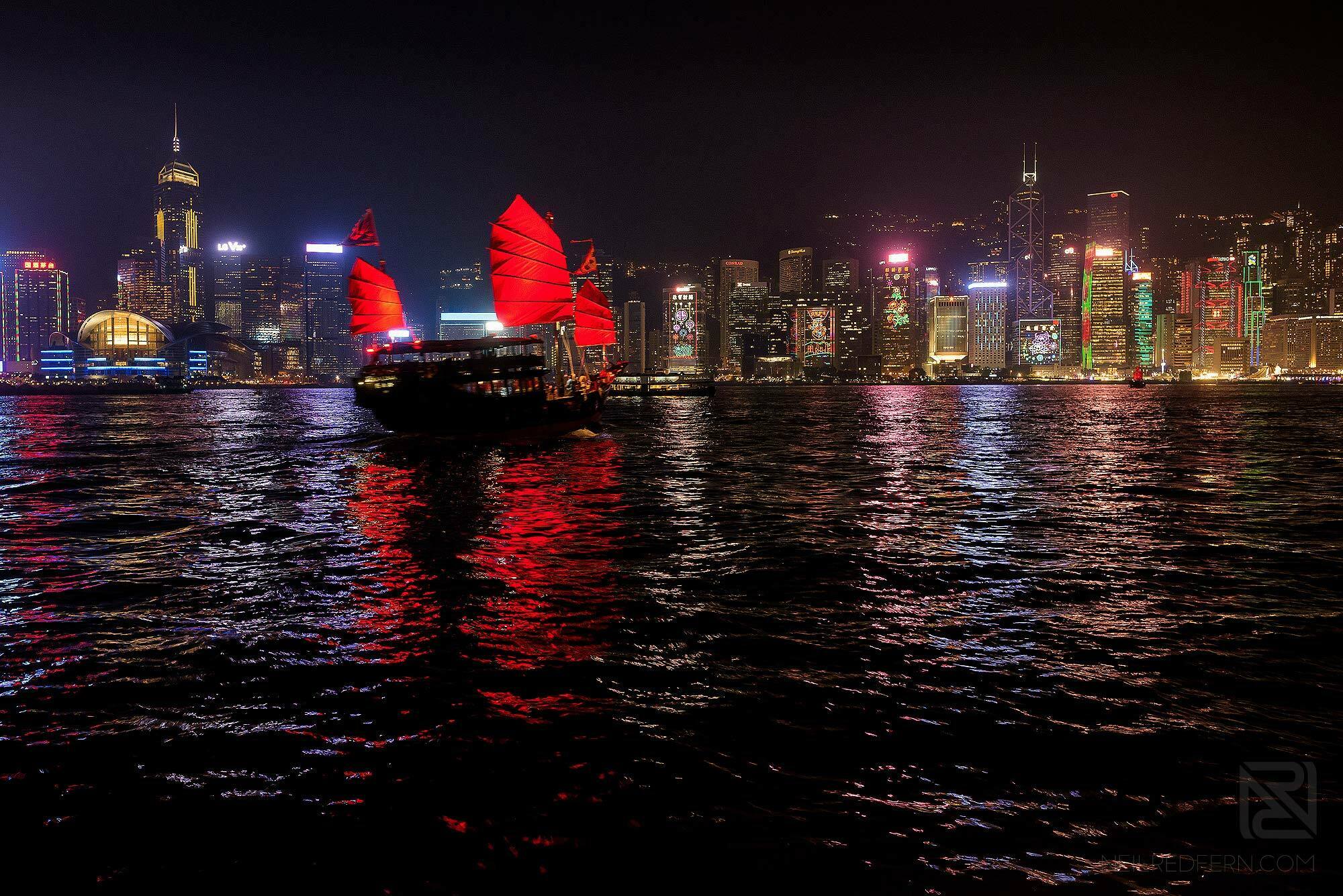 Hong Kong Travel Photography 10 boat sailing in Victoria Harbour at night time