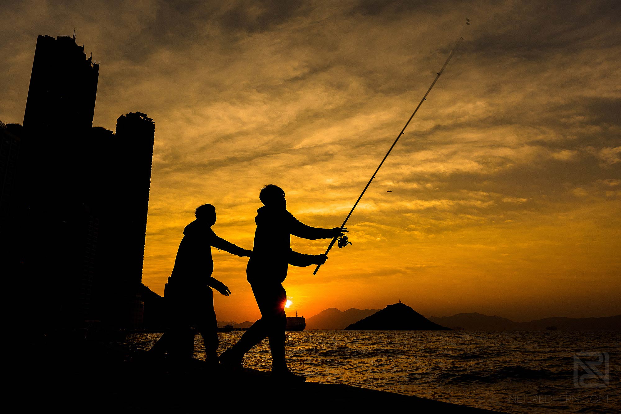 Hong Kong Travel Photography 29 two boys fishing at sunset in Kennedy Town