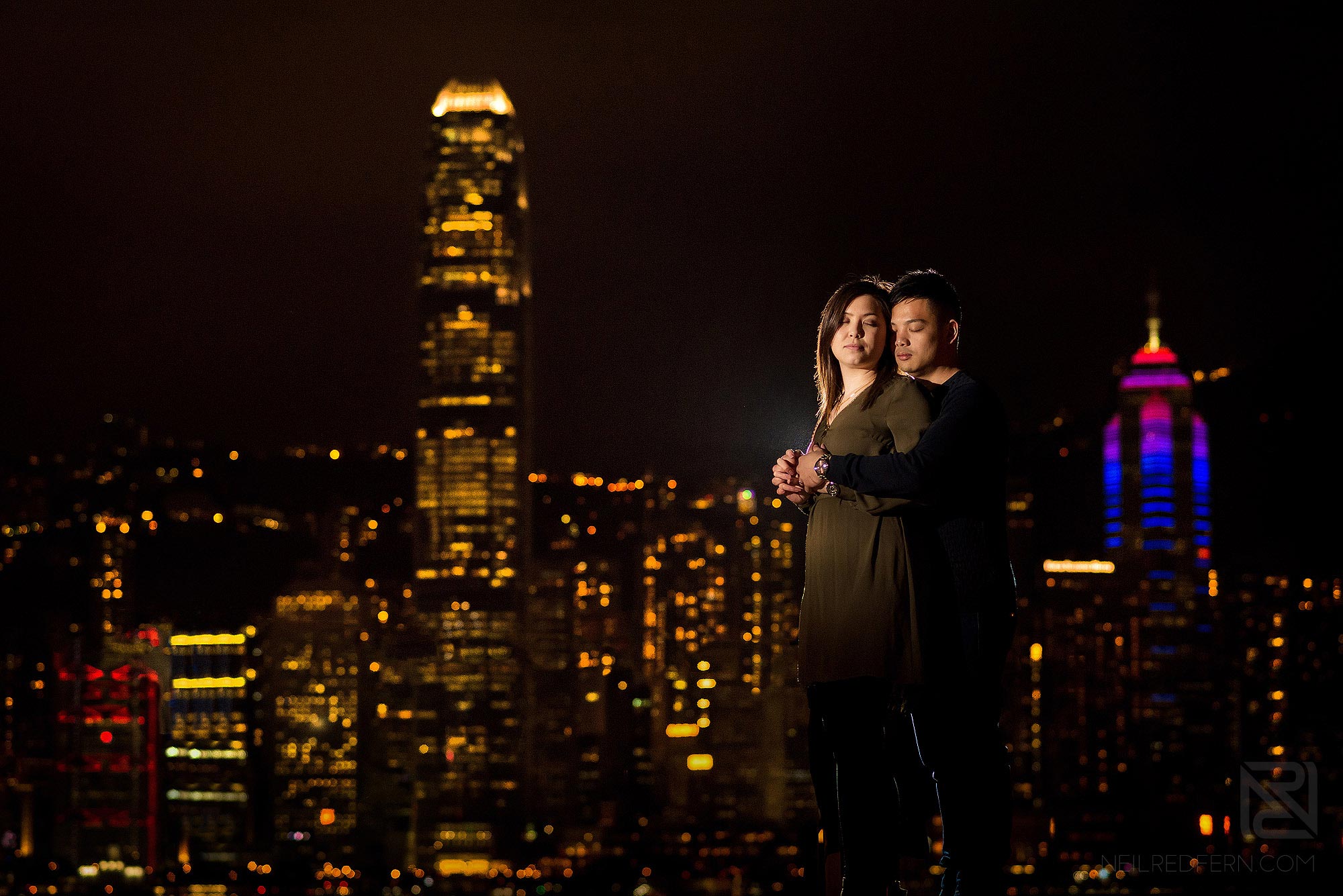 bride and groom portrait in front of Victoria Harbour in Hong Kong
