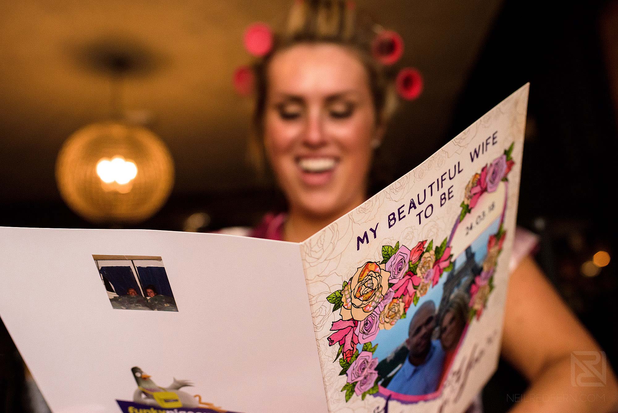 happy bride reading card from groom