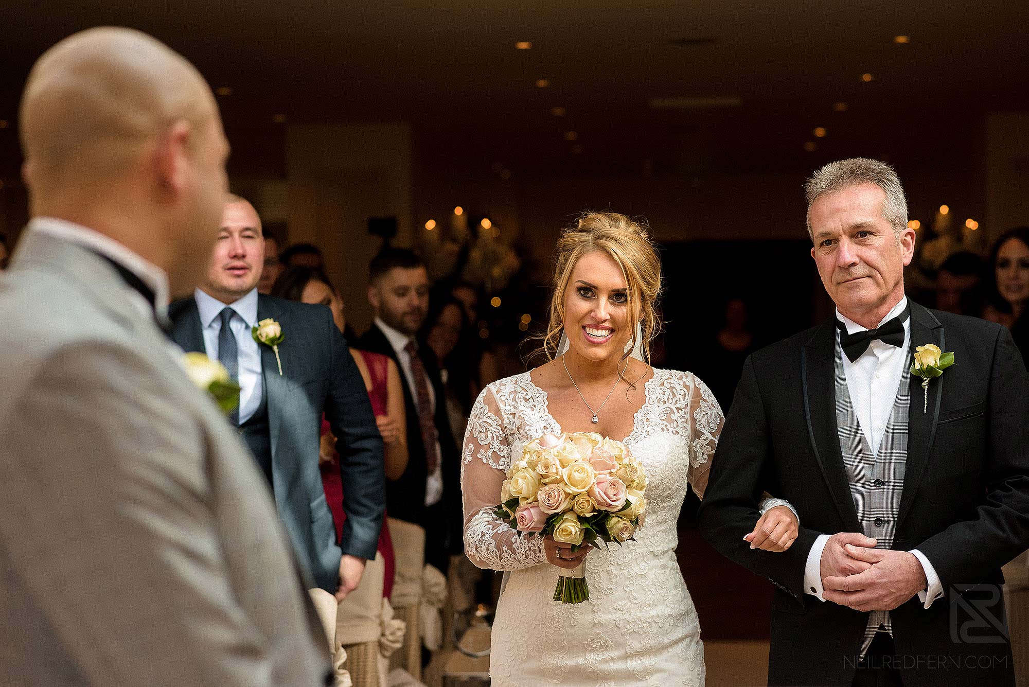 bride walking down the aisle at Mitton Hall in Lancashire