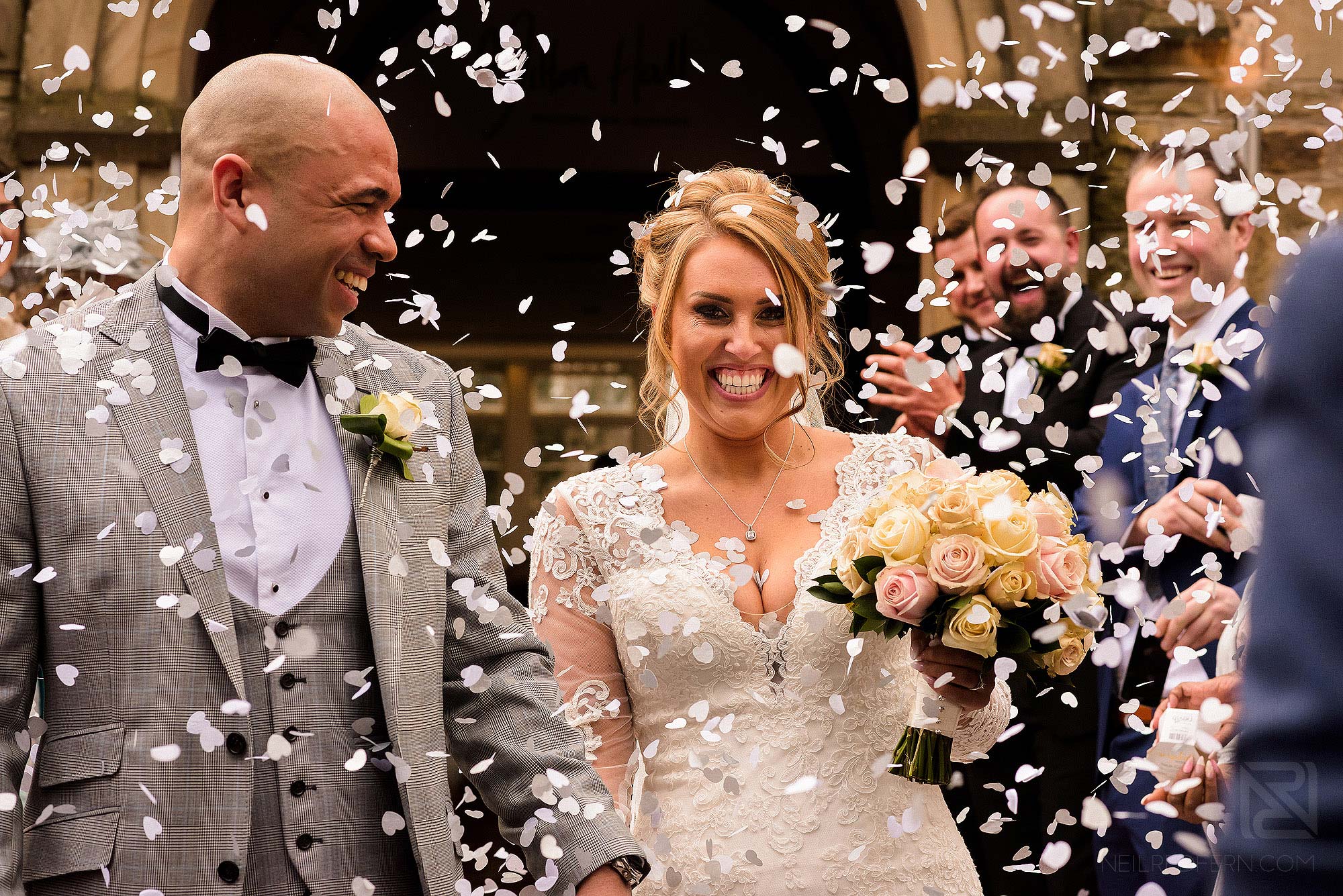 confetti being thrown at Spring wedding at Mitton Hall