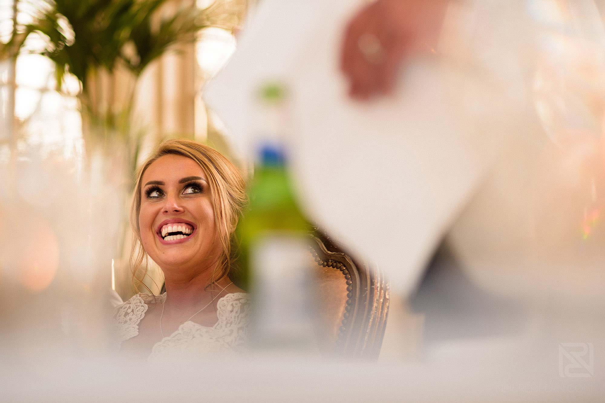 bride looking at groom and laughing at Mitton Hall