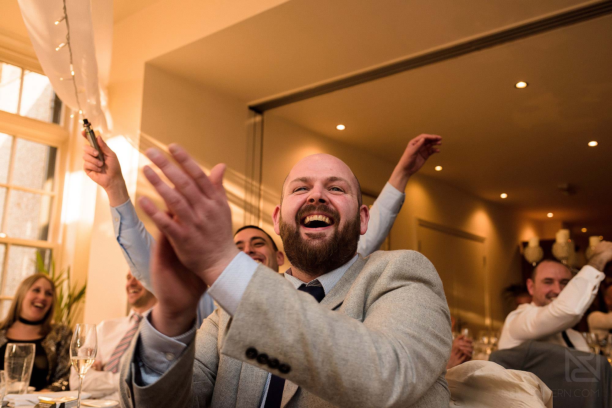 wedding guest applauding groom's speech