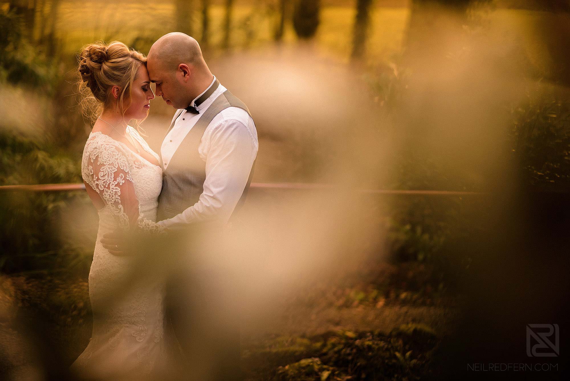 evening sunset portrait of bride and groom at Mitton Hall spring wedding