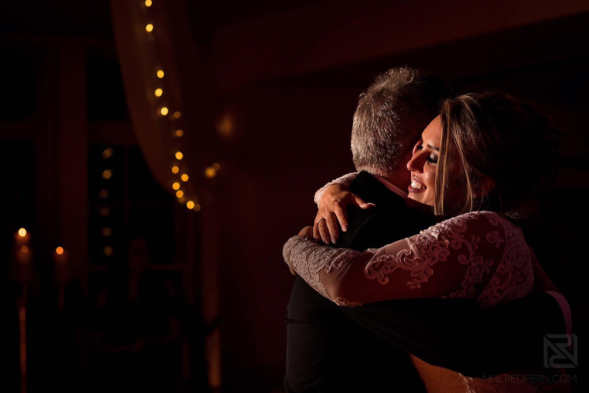 bride hugging dad on dancefloor