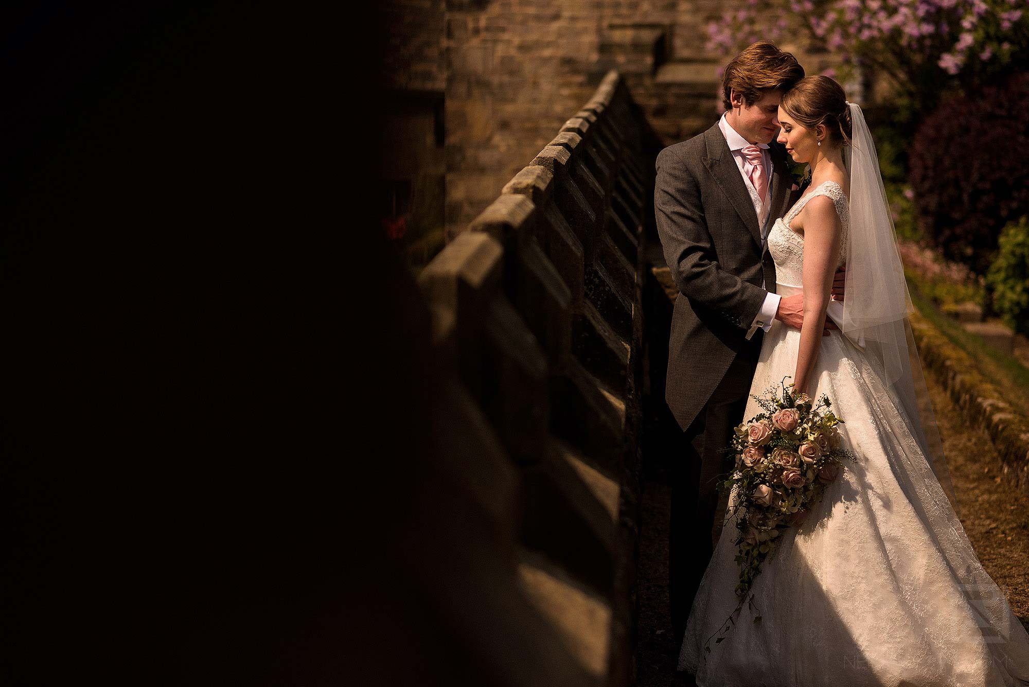 stunning portrait of bride and groom outside Hoghton Tower