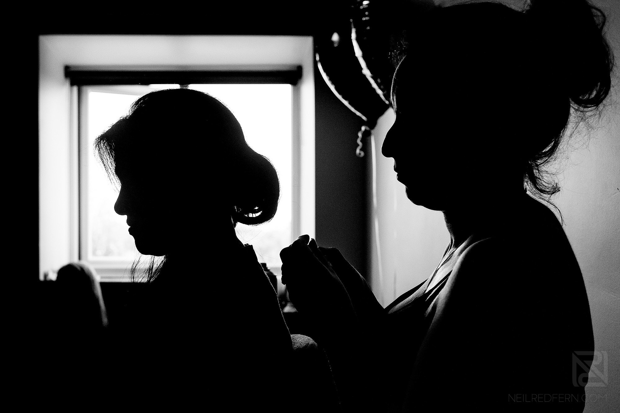 silhouette photograph of bridesmaids getting ready at Wirral wedding