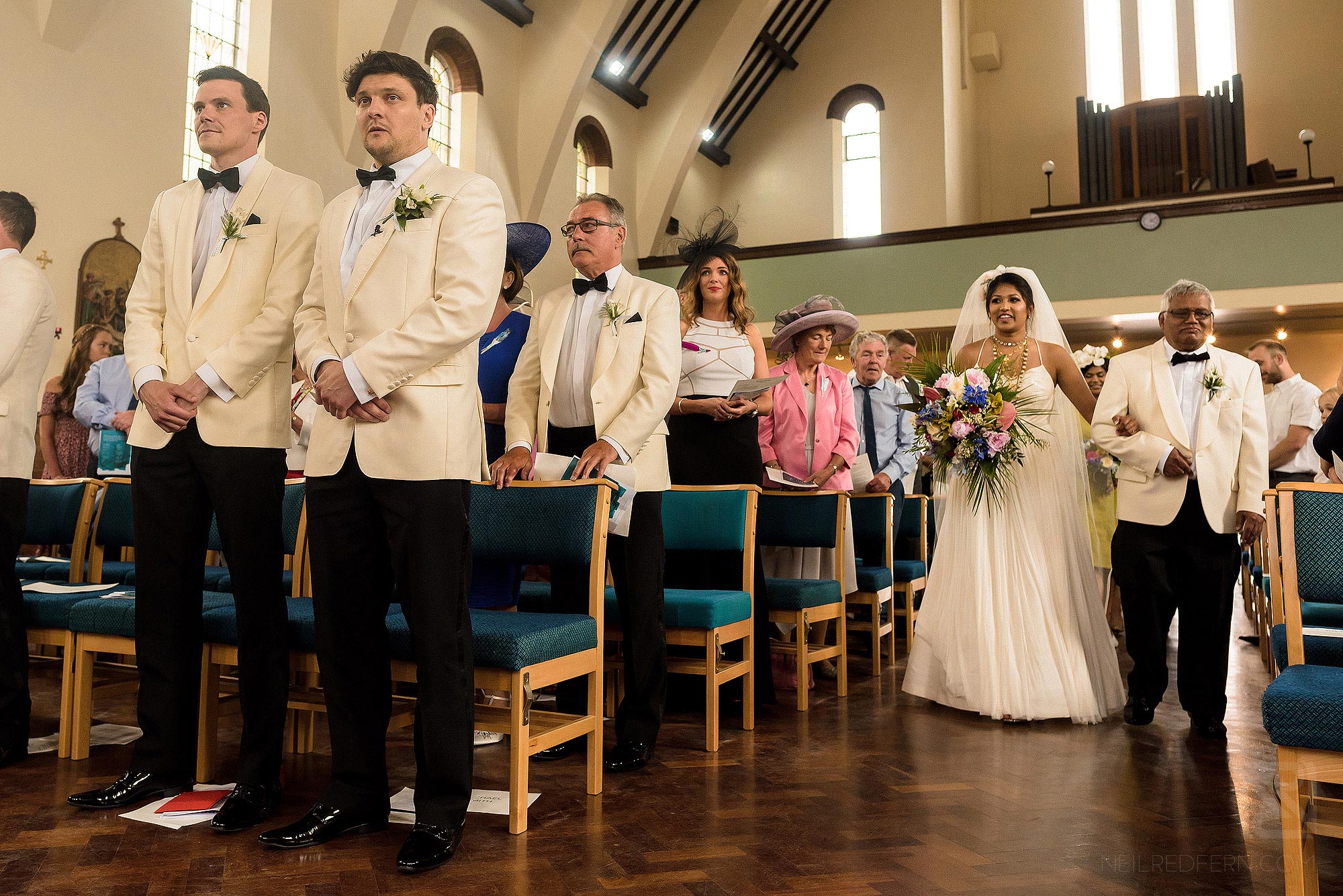 bride walking up the aisle with father