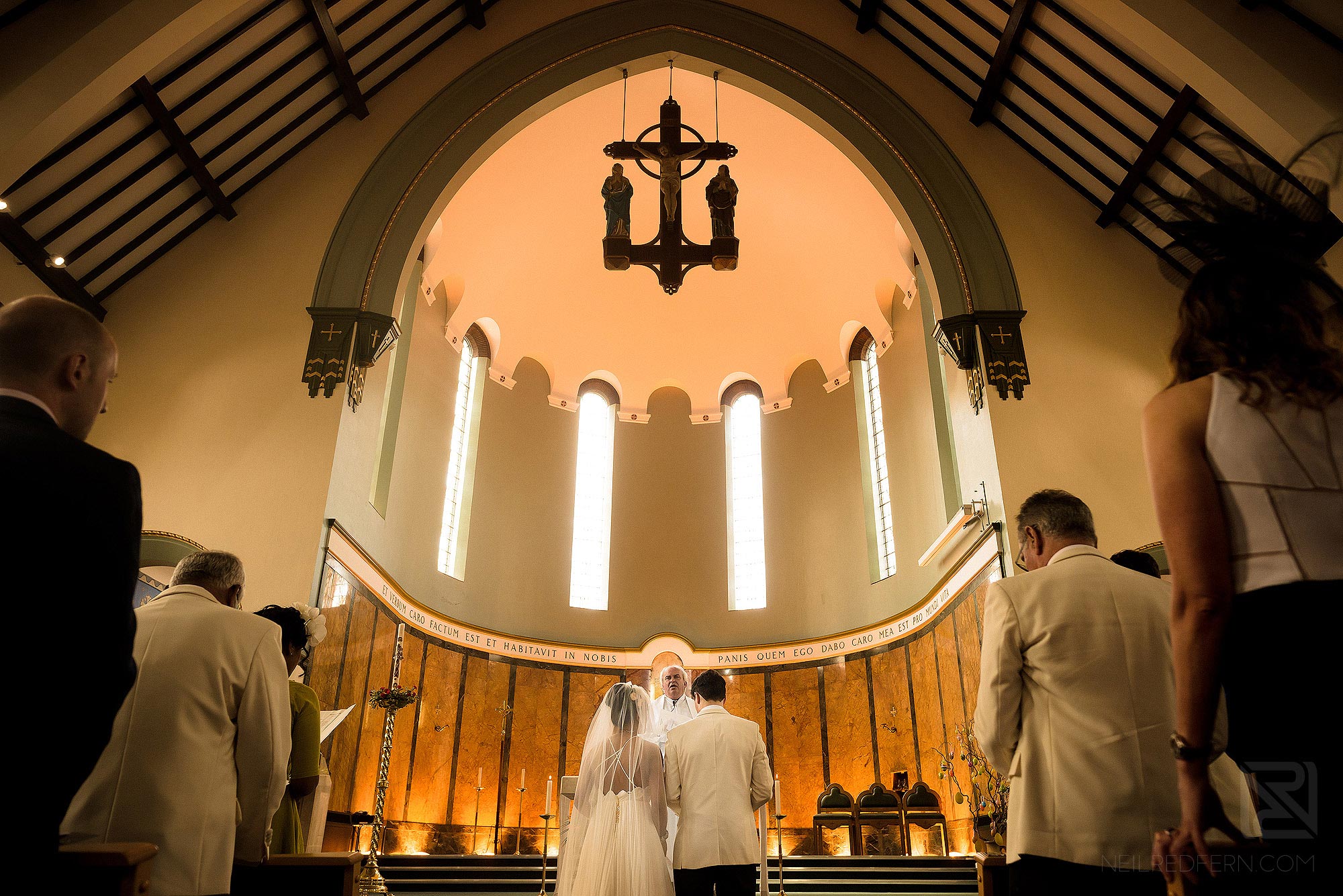 bride and groom at the alter during wedding ceremony