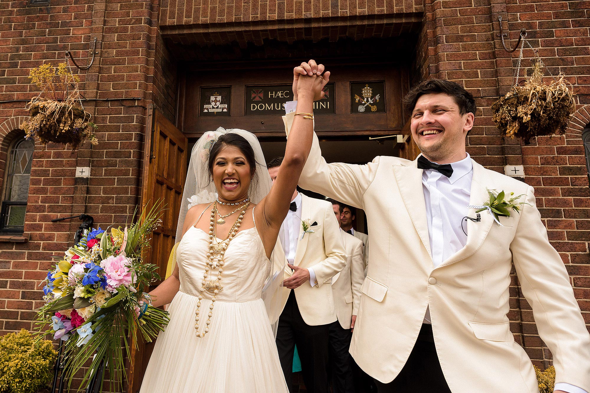 happy bride and groom leaving church