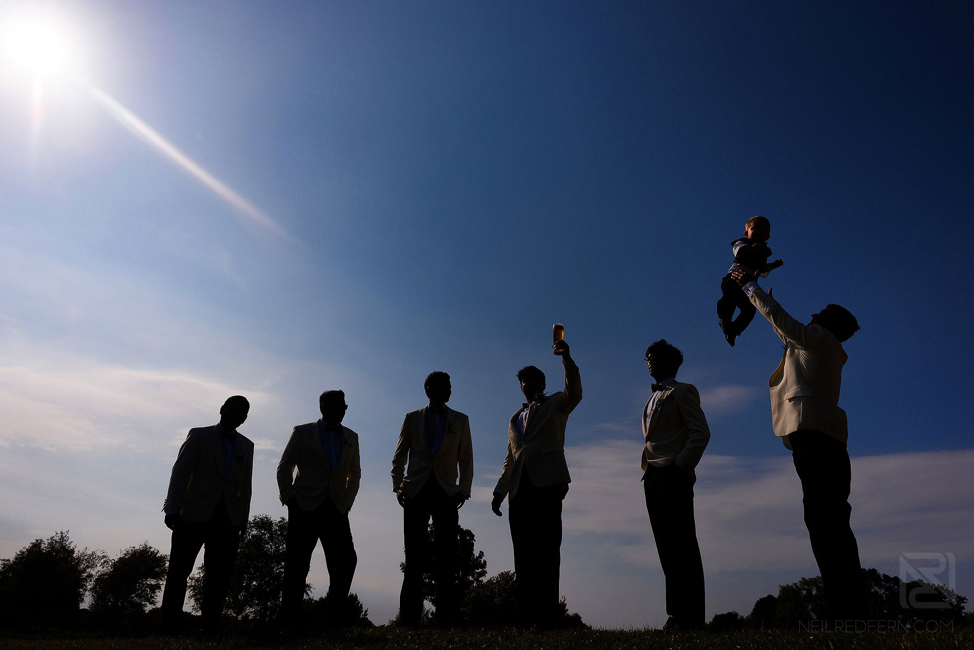 silhouette photograph of groomsmen