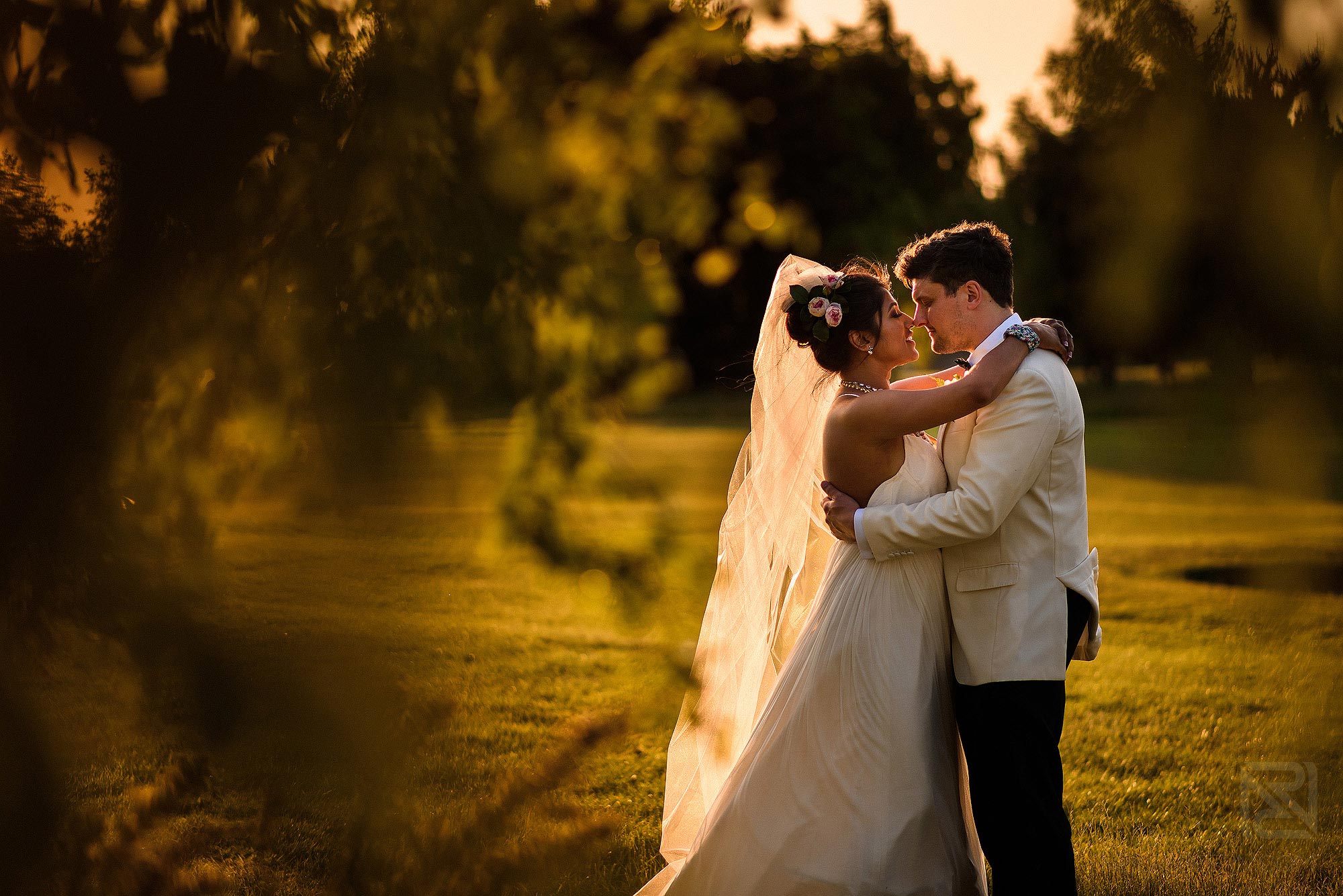 beautiful portrait of bride and groom at sunset