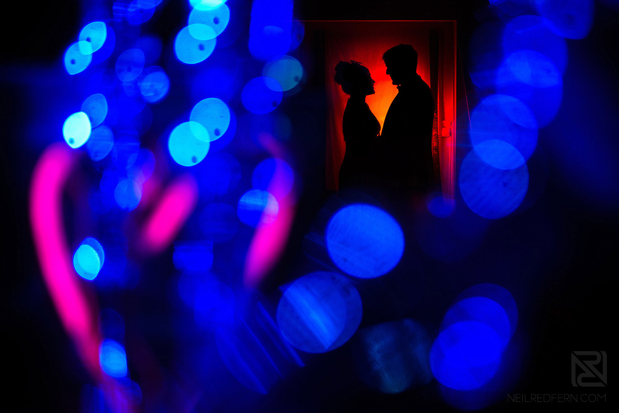 creative portrait of bride and groom using flash