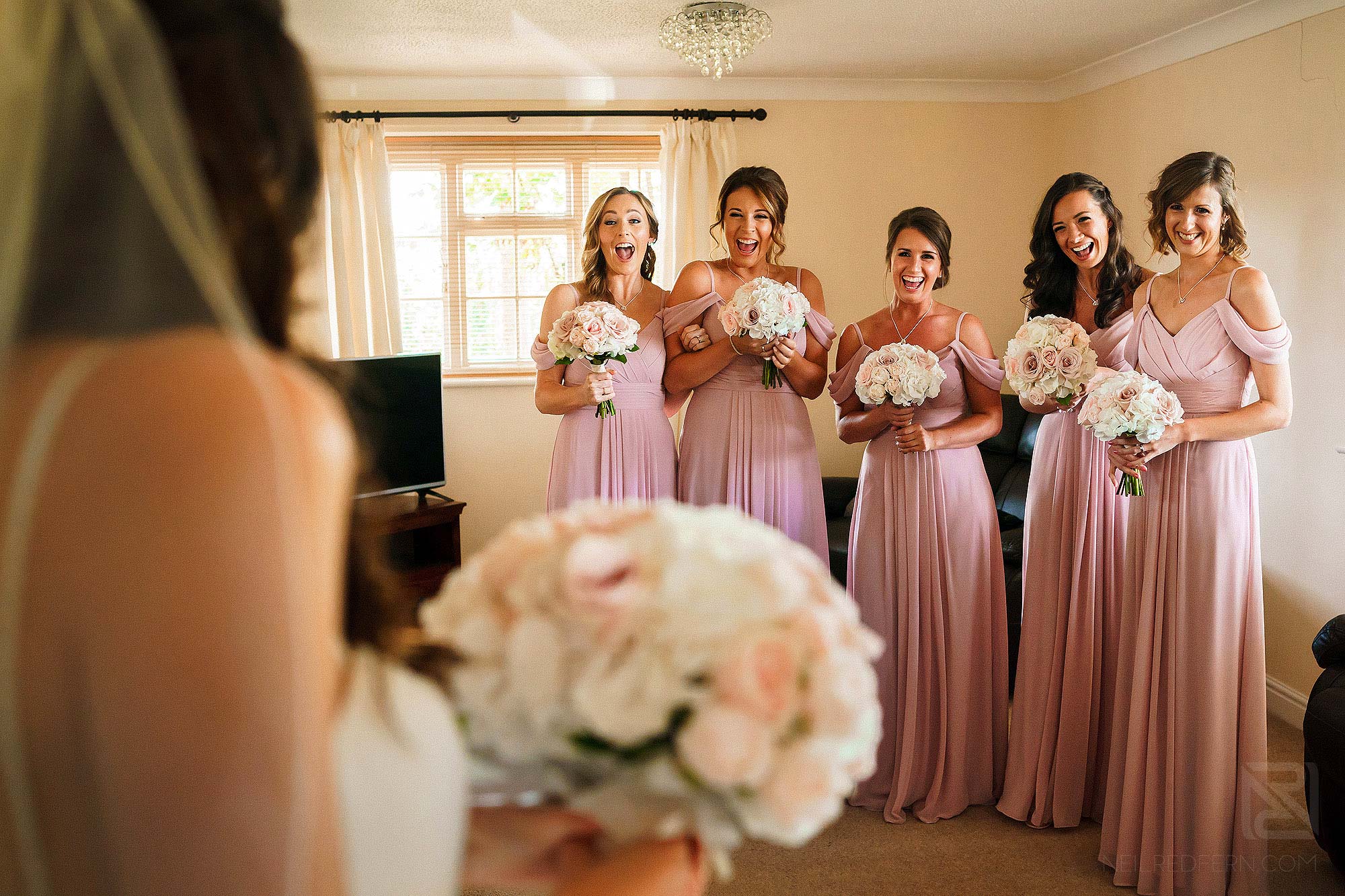 bridesmaid seeing bride in dress for first time