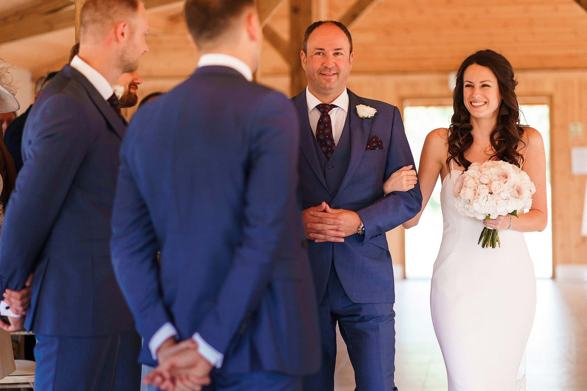 bride walking down the aisle with father