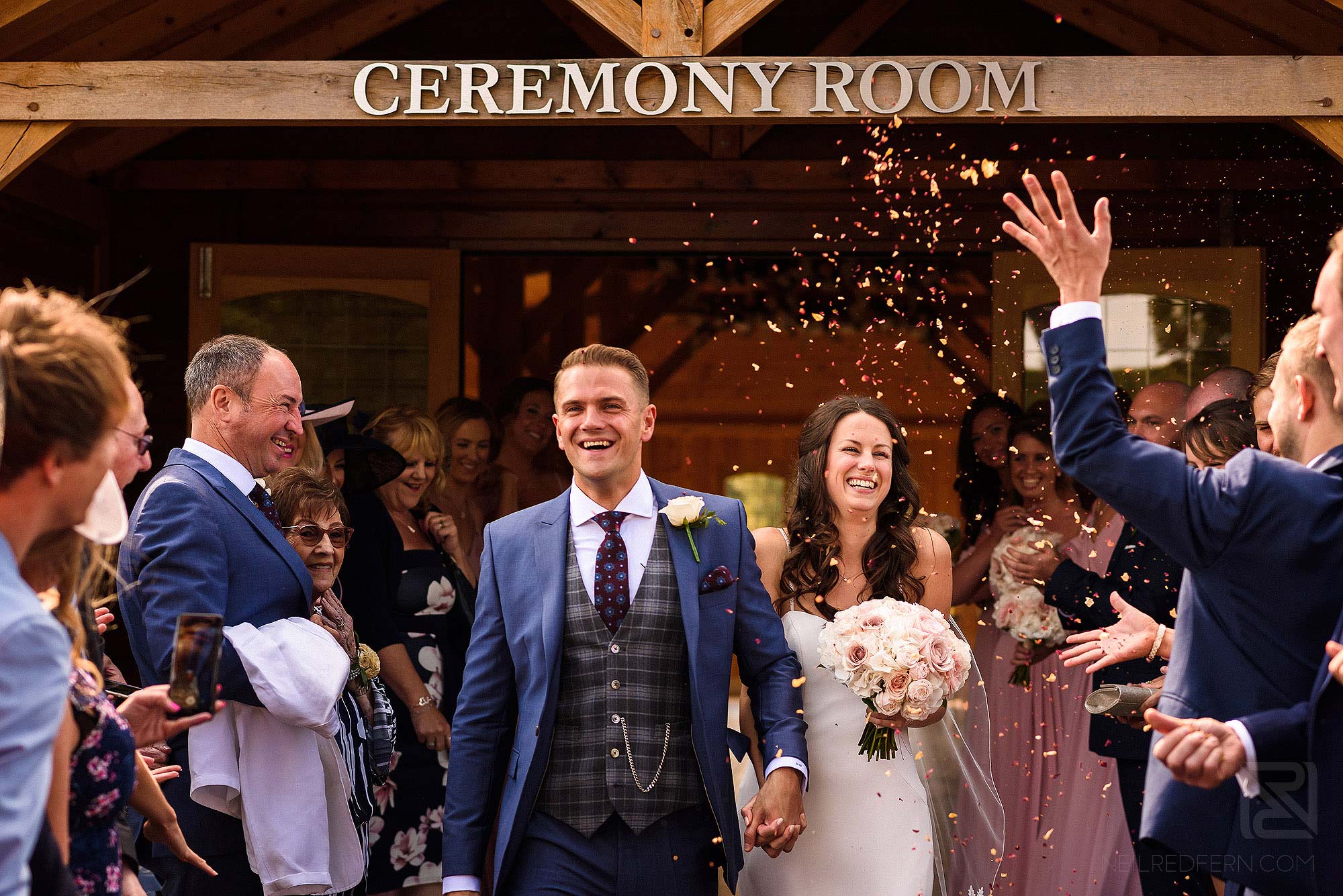 guests throwing confetti at Merrydale Manor wedding