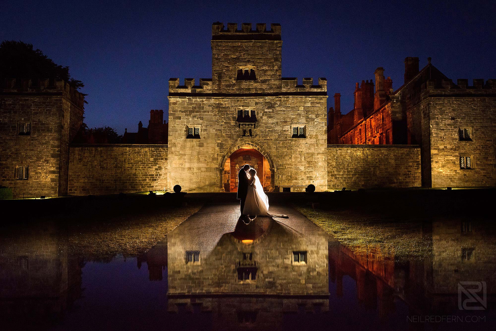 evening portrait of bride and groom outside Hoghton Tower in Lancashire