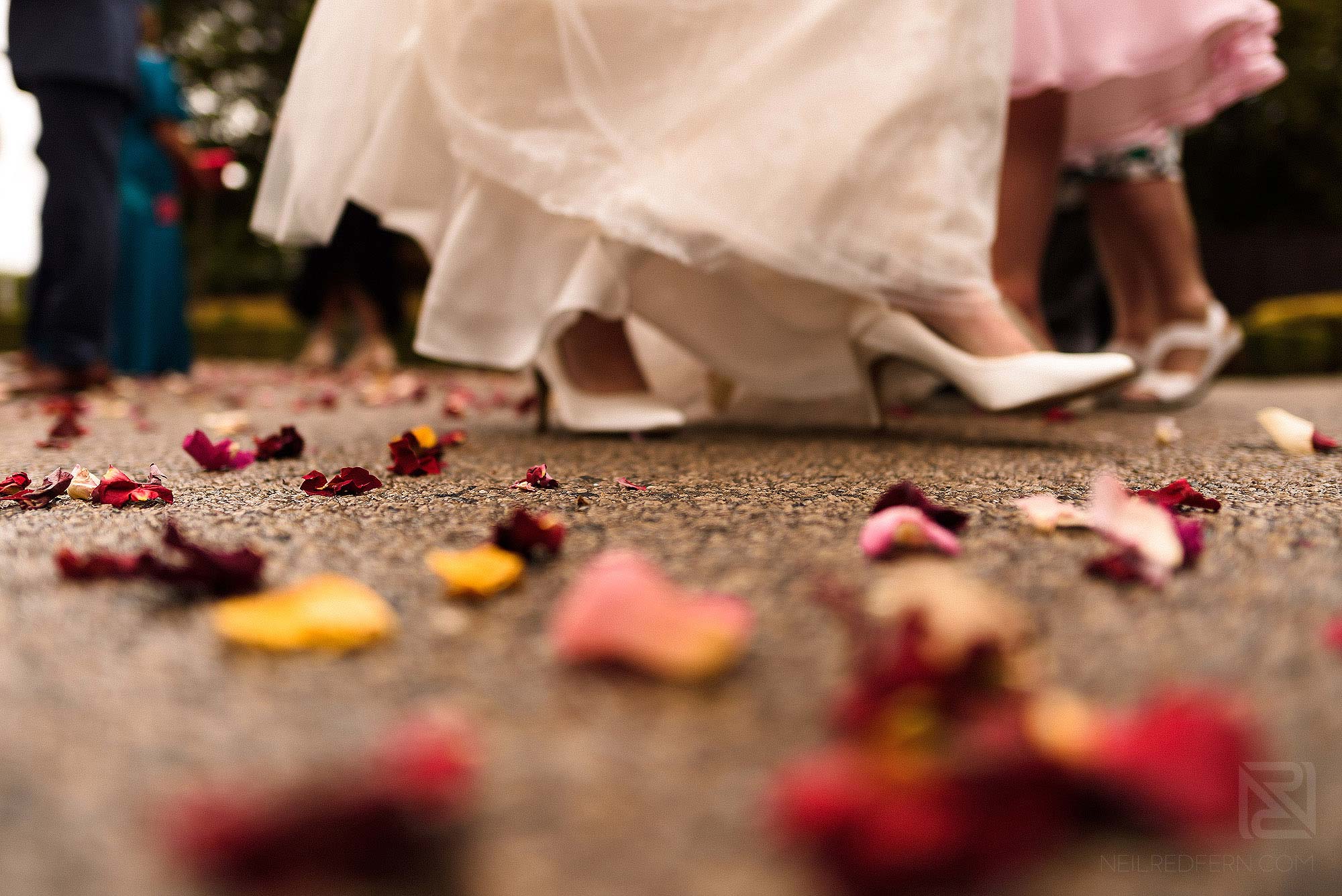 bride walking over confetti