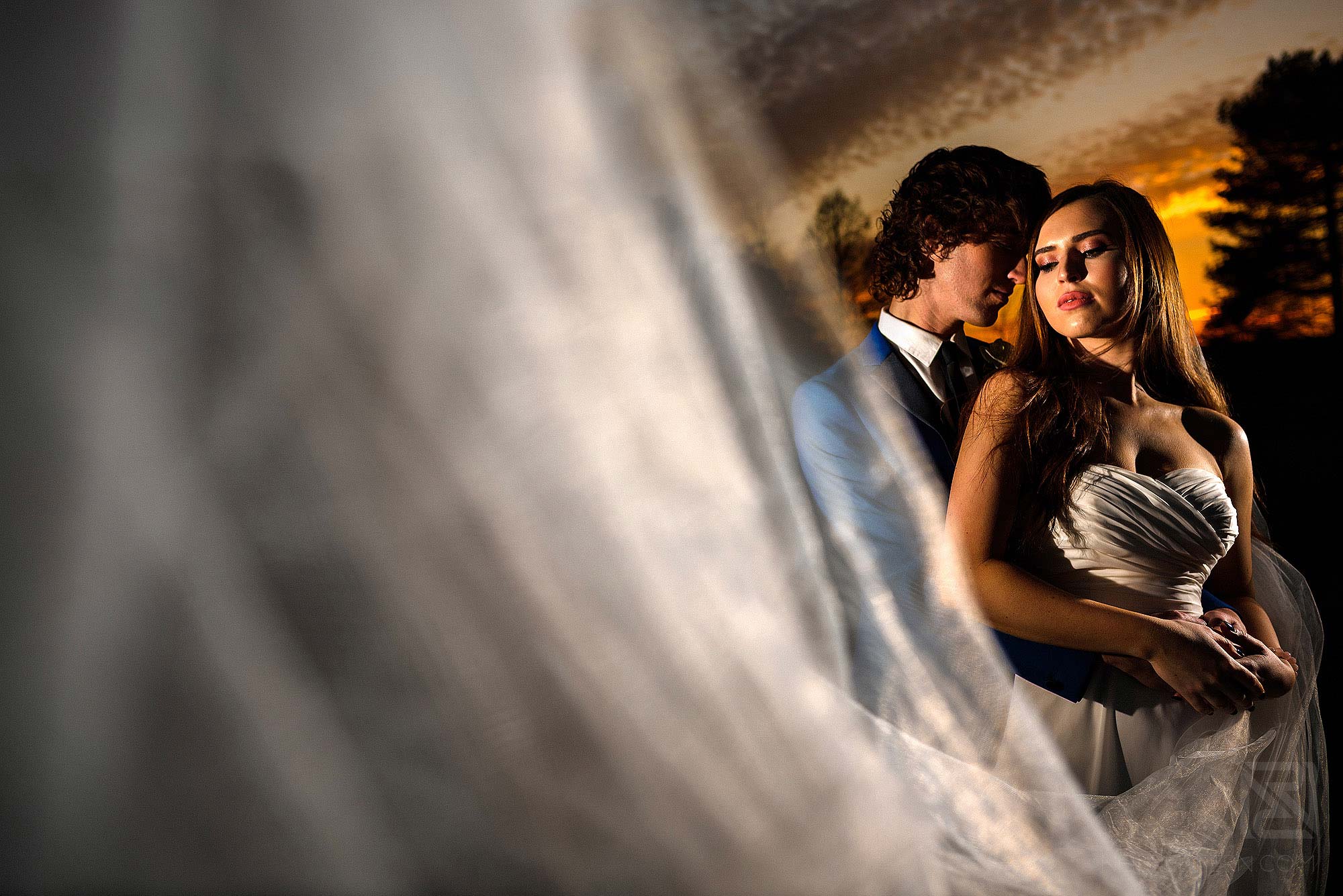 evening off camera flash portrait of bride and groom