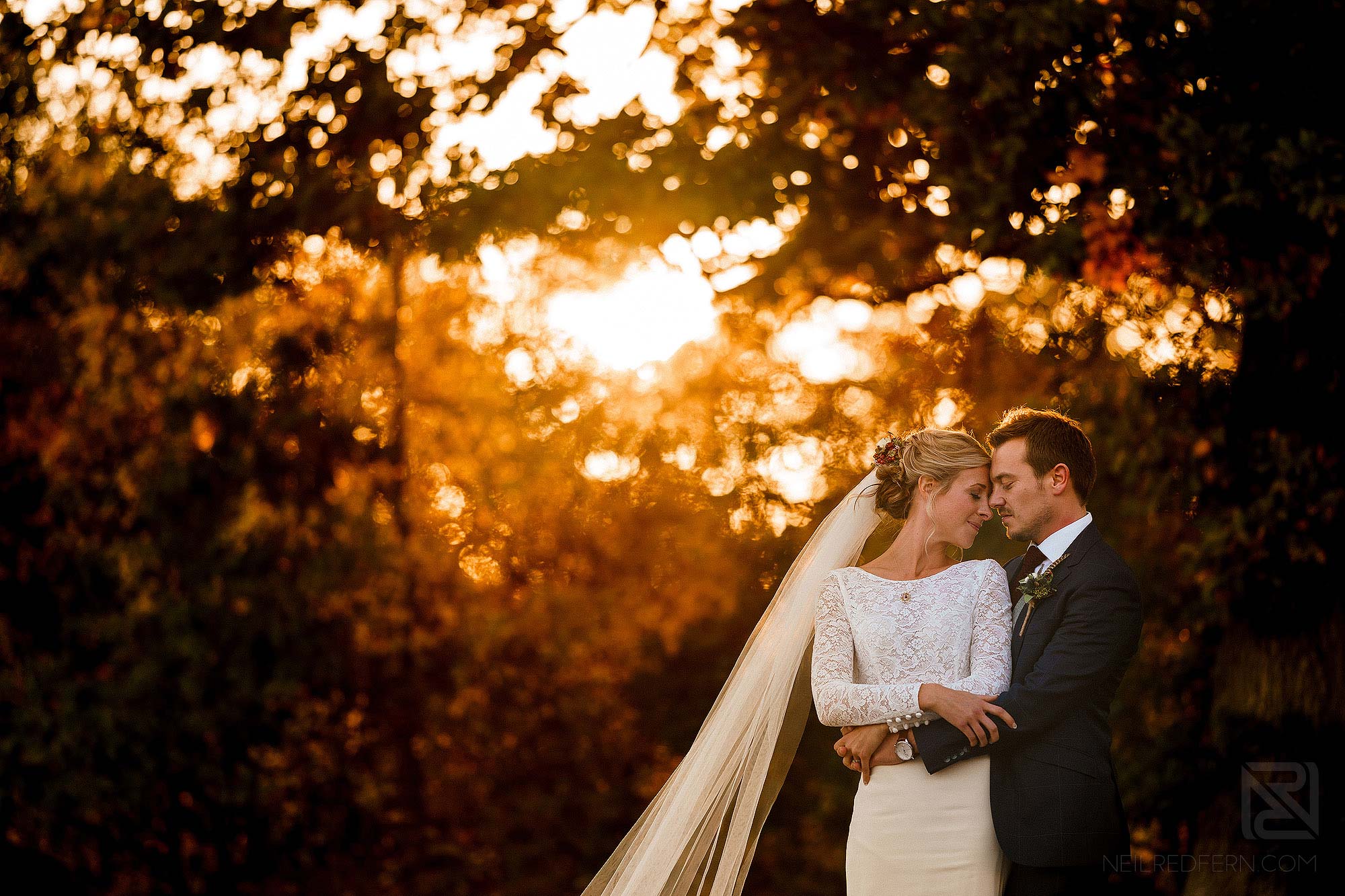 beautiful newlywed portrait of bride and groom at sunset