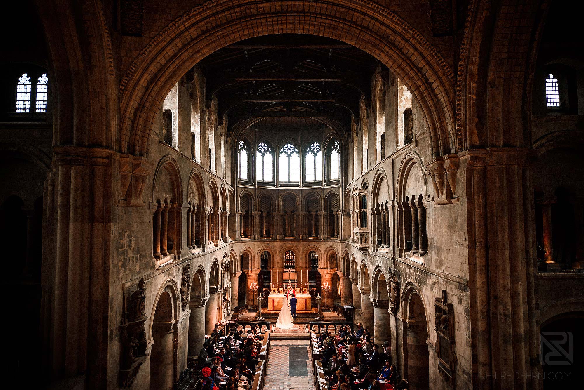 wide angle photograph of wedding ceremony at St Bartholomew-the-Great in London