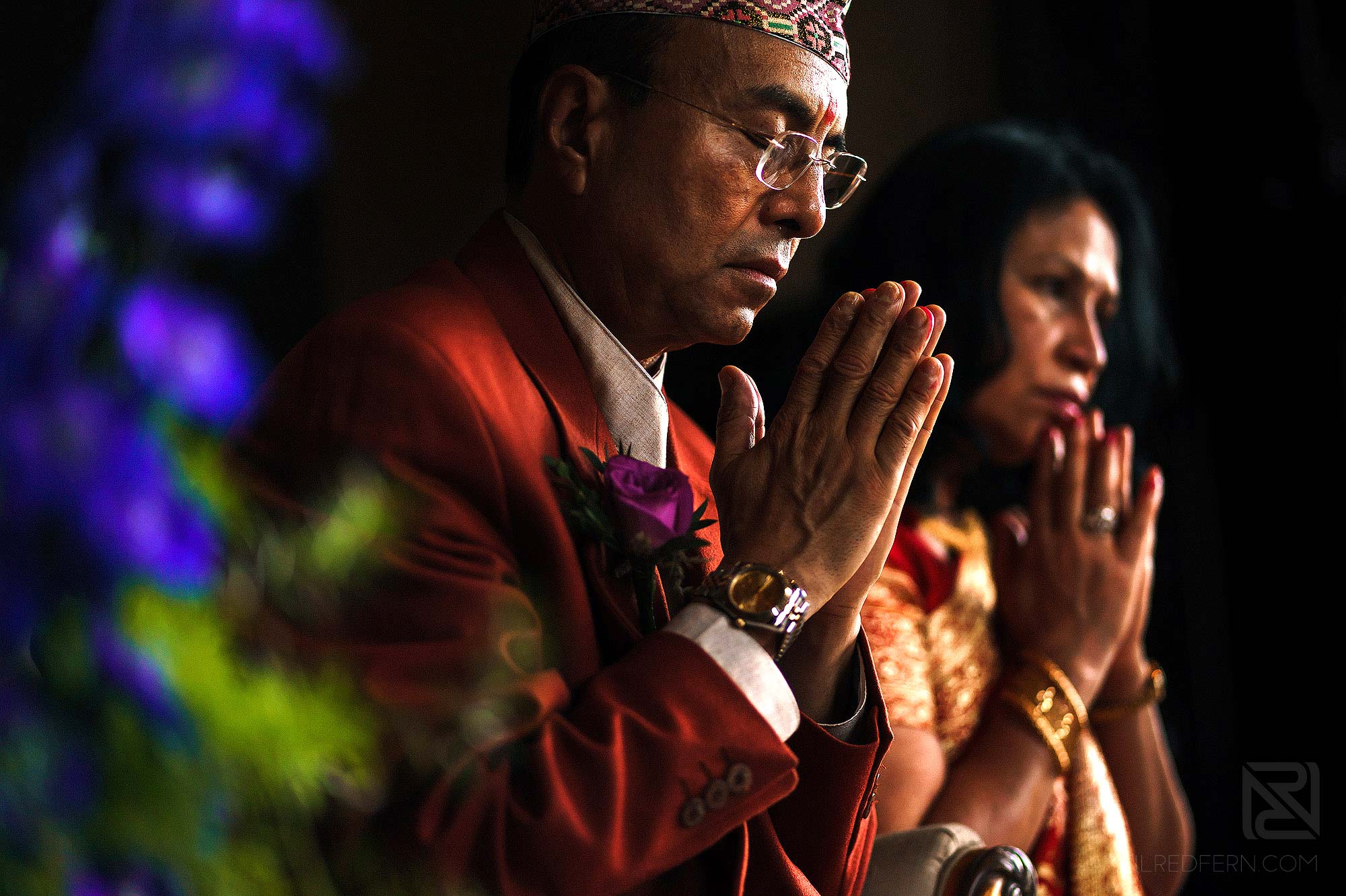 parents praying during Indian wedding ceremony