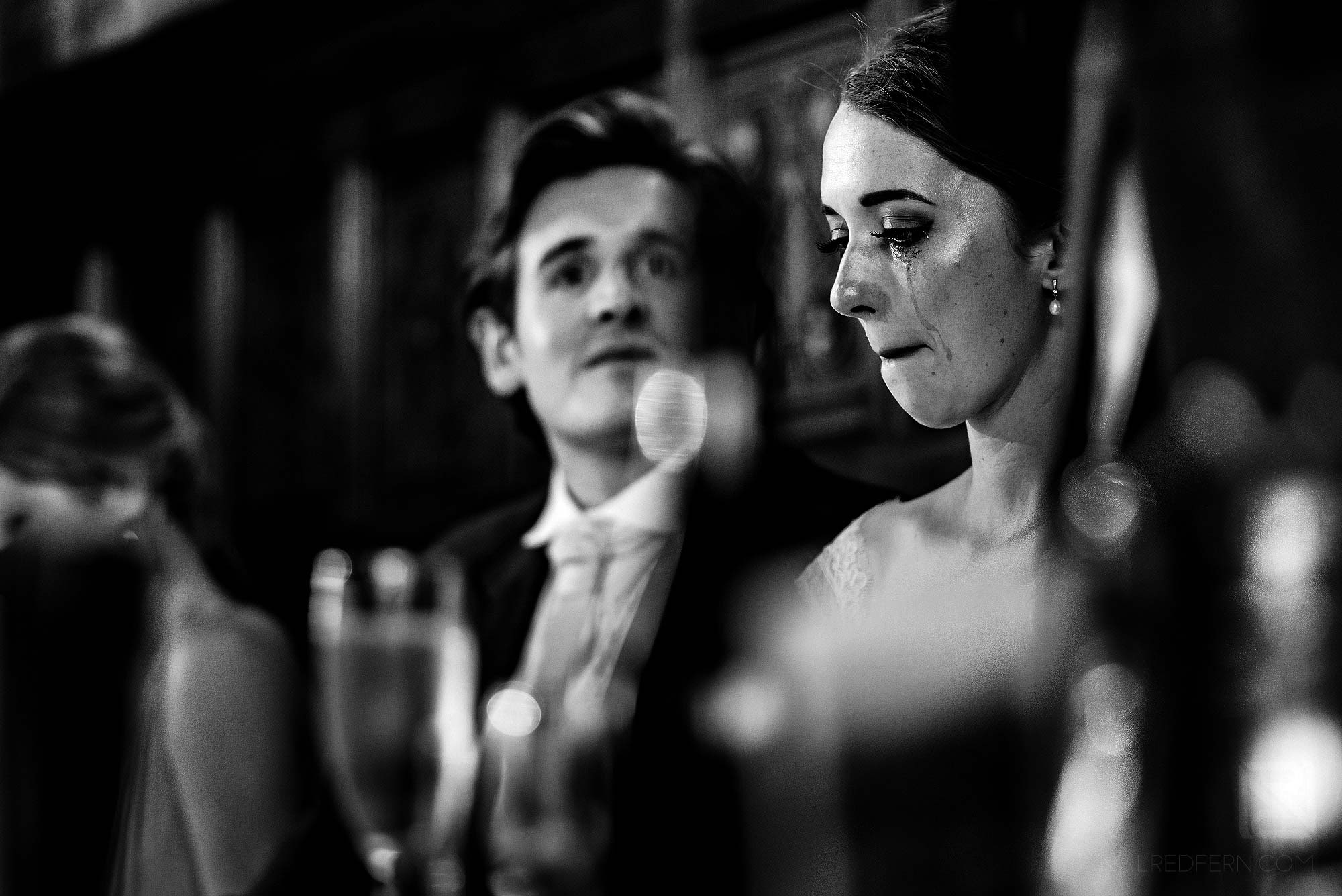 emotional bride crying during wedding speeches